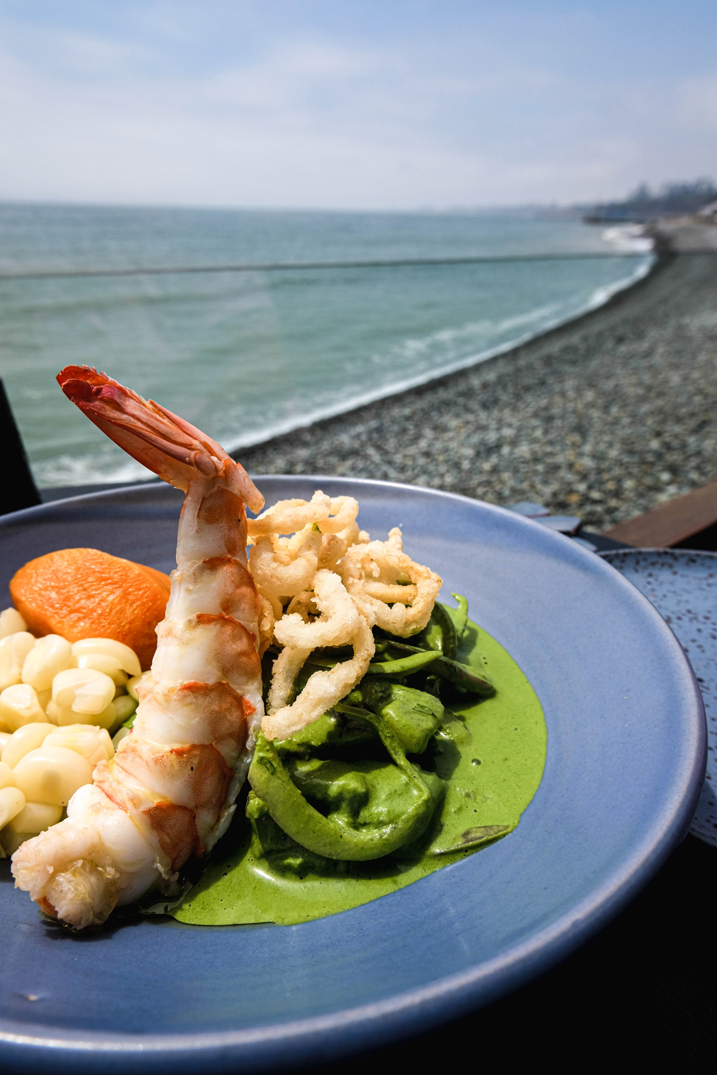 Green Ceviche. A succulent King prawn, fried onions, corn, sweet potato and a coriander based leche de Tigre. One of my last meals in Lima. Eaten staring out at the Pacific, this is possibly one of the most delicious dishes I've ever eaten.