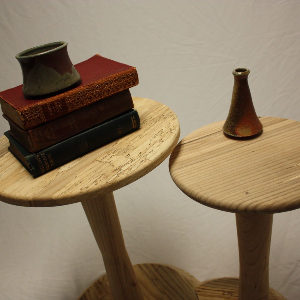Elm side table with books and vase