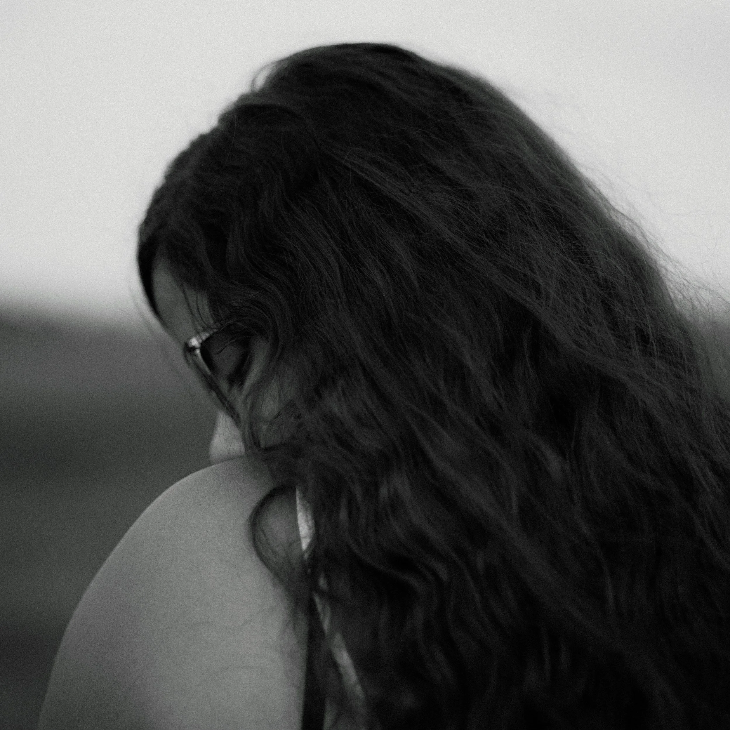 young woman with her face turned away from the camera