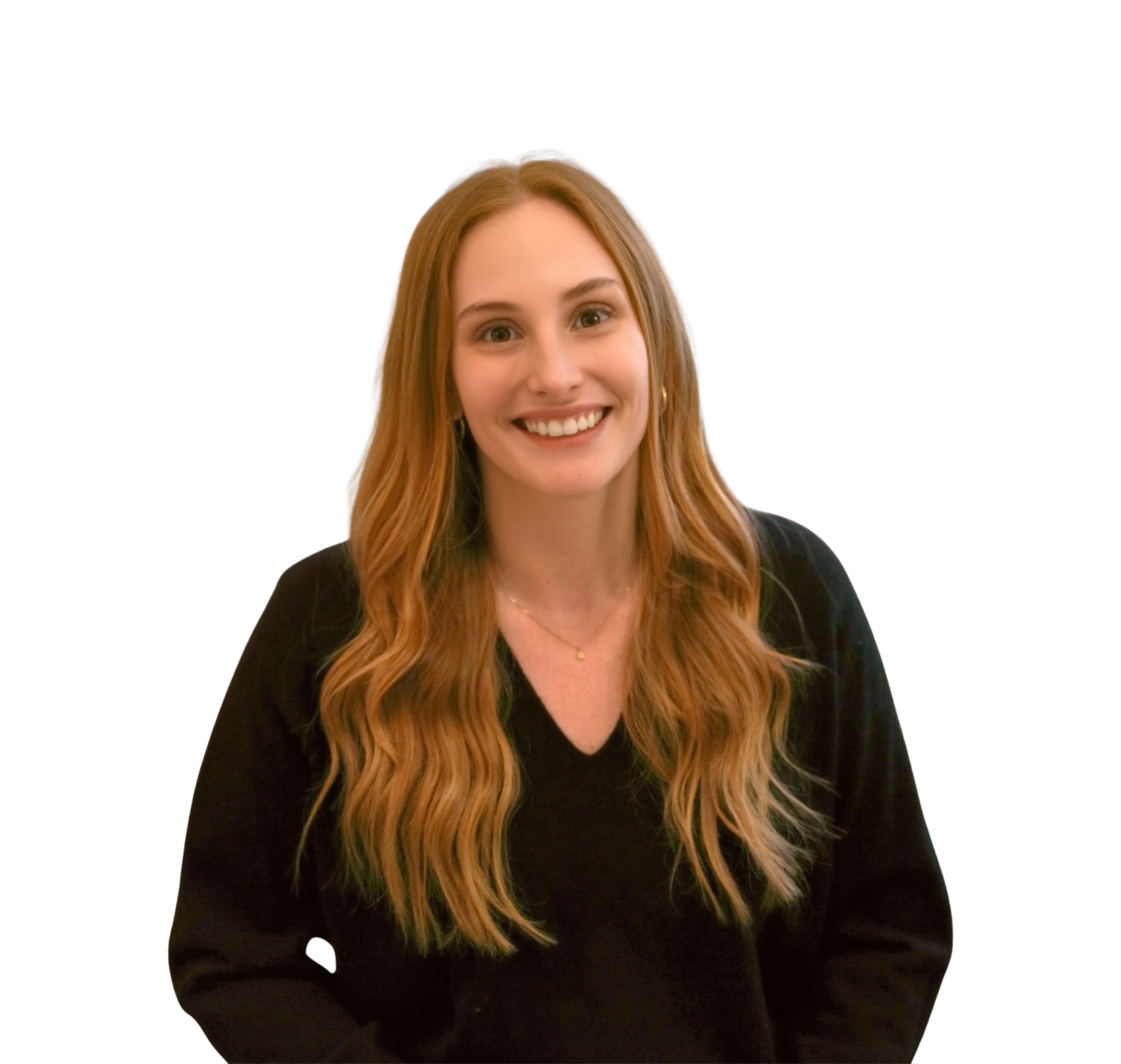 Young woman with red hair and a black shirt smiling at the camera