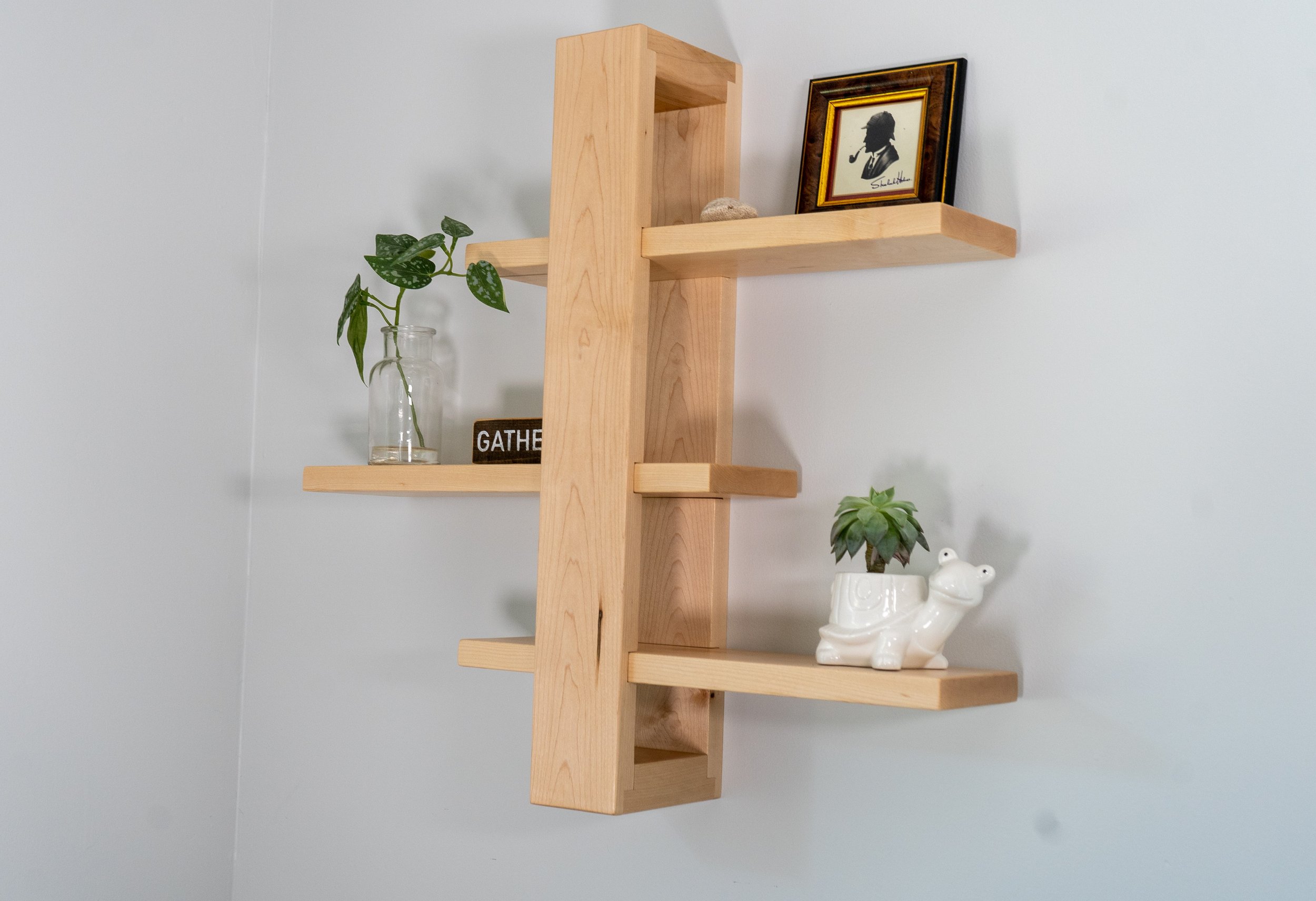 Maple floating sliding shelf on living room wall
