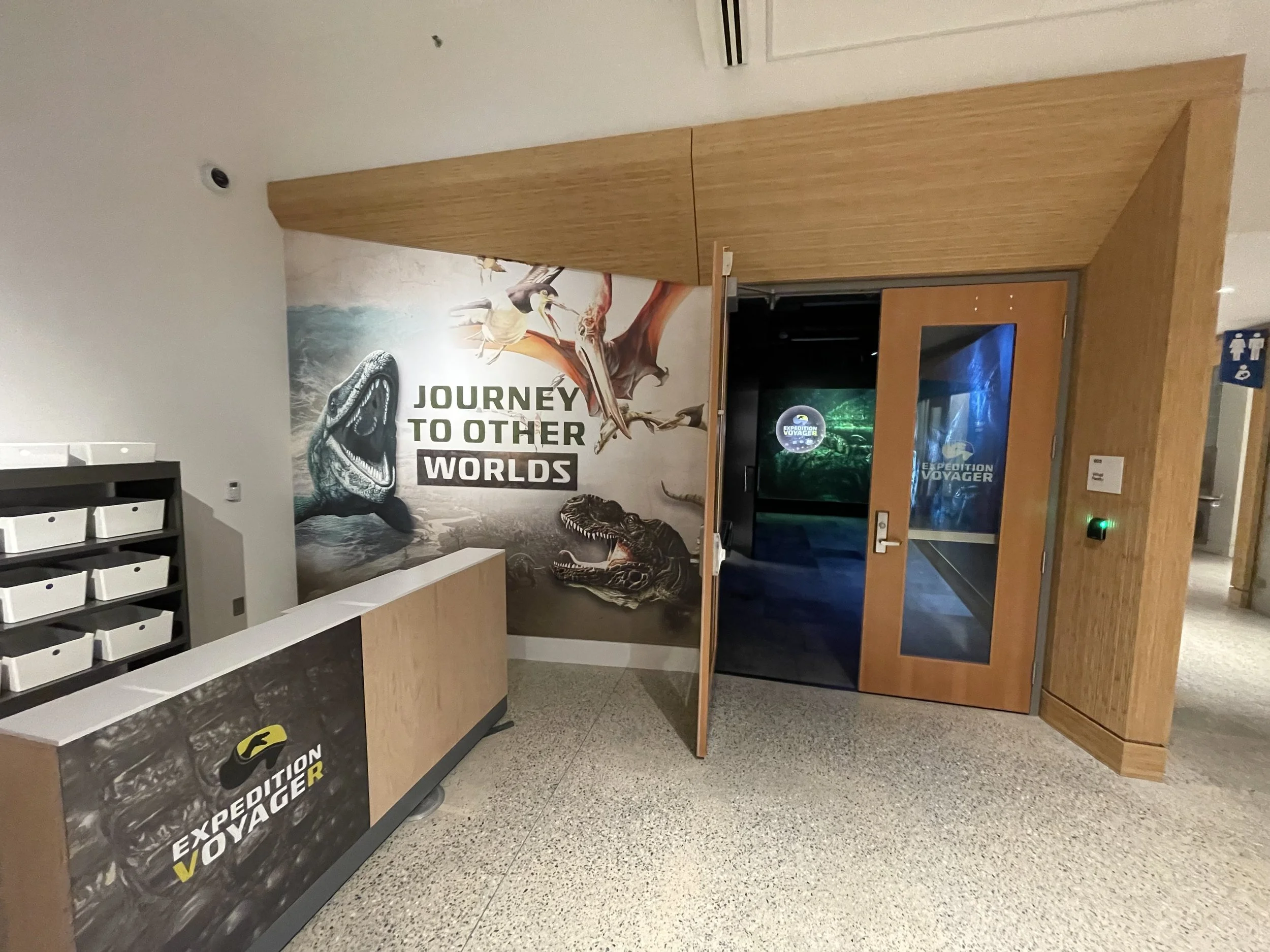 People in VR headsets playing in a Virtual Reality Arena at The Rabbit Hole VR FEC