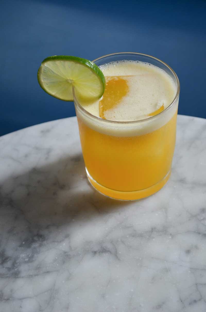 passion of rita cocktail with lime garnish