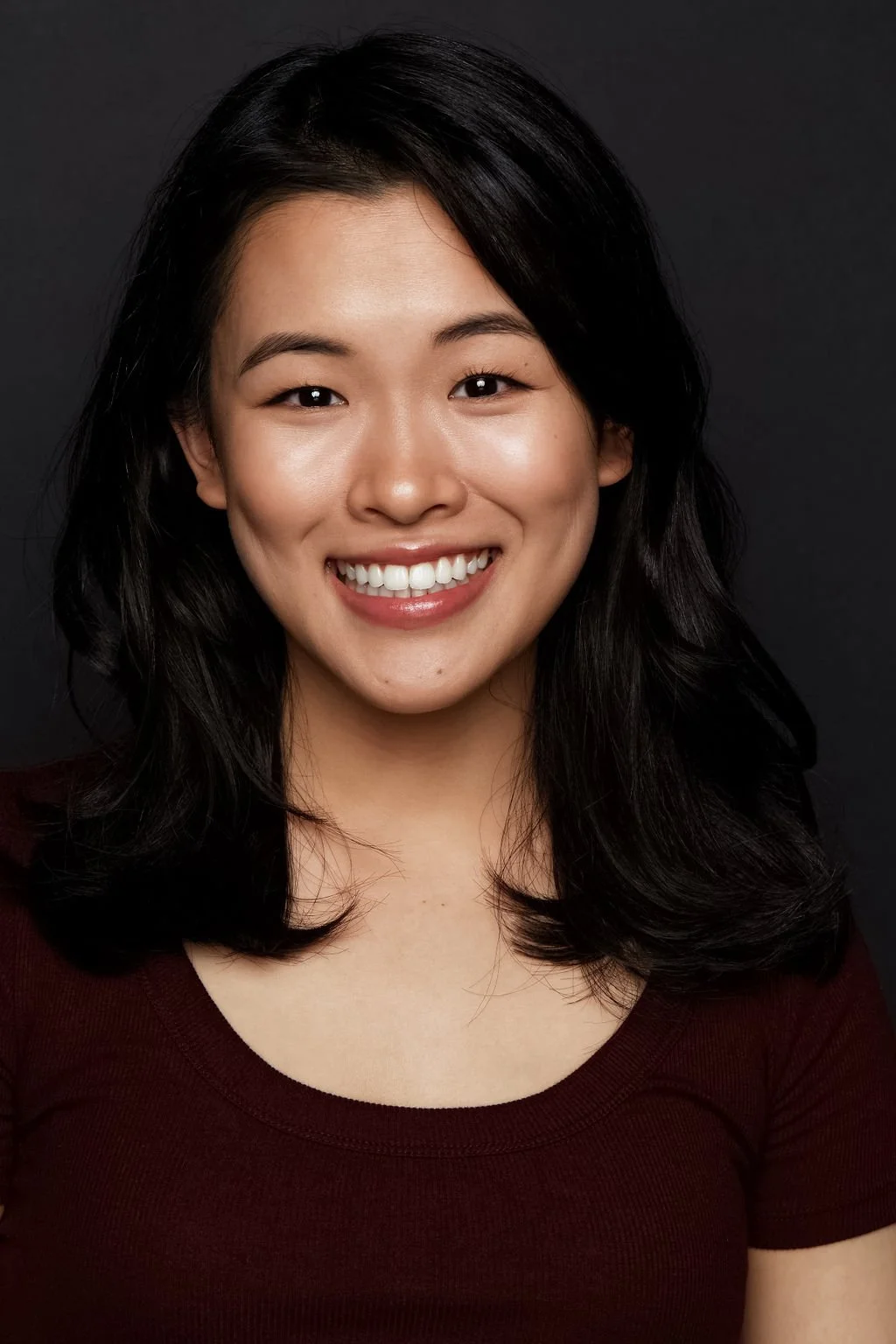 smiling asian woman actor headshot vancouver 