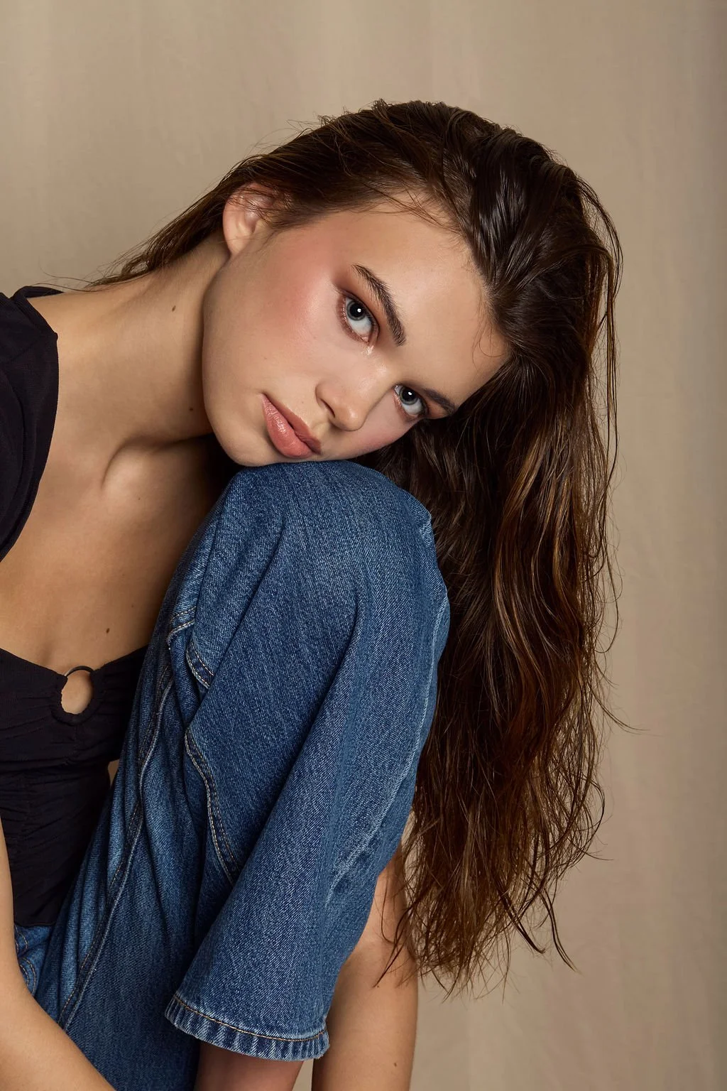 long haired brunette model in studio with dreamy beauty look 