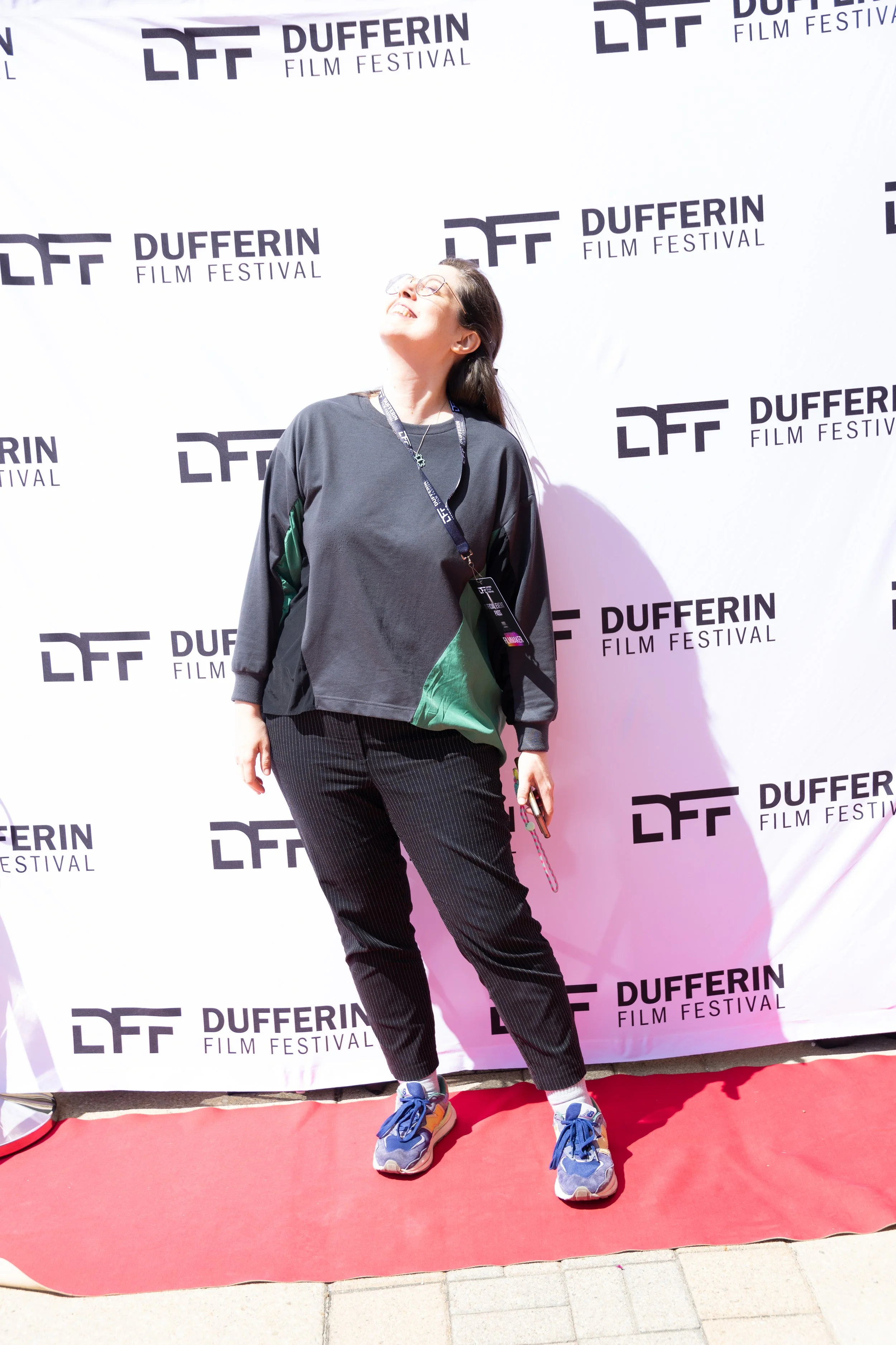 Person standing on red carpet at Dufferin Film Festival