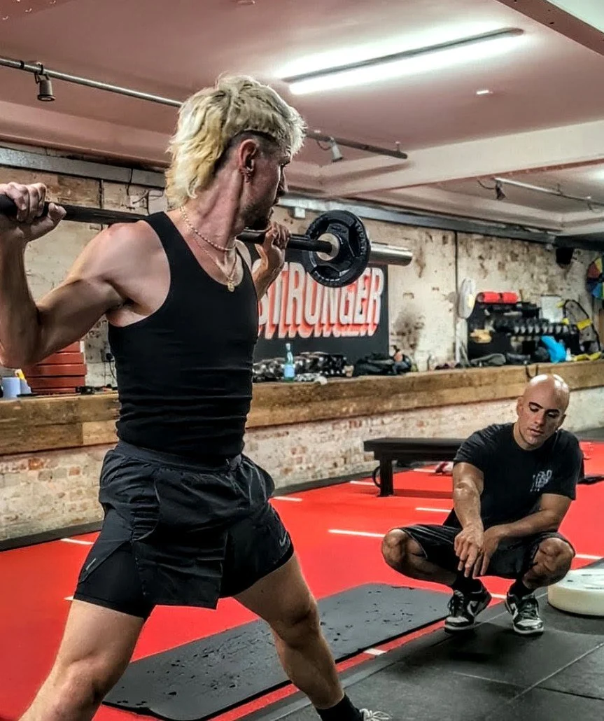Calisthenics coach with a client.