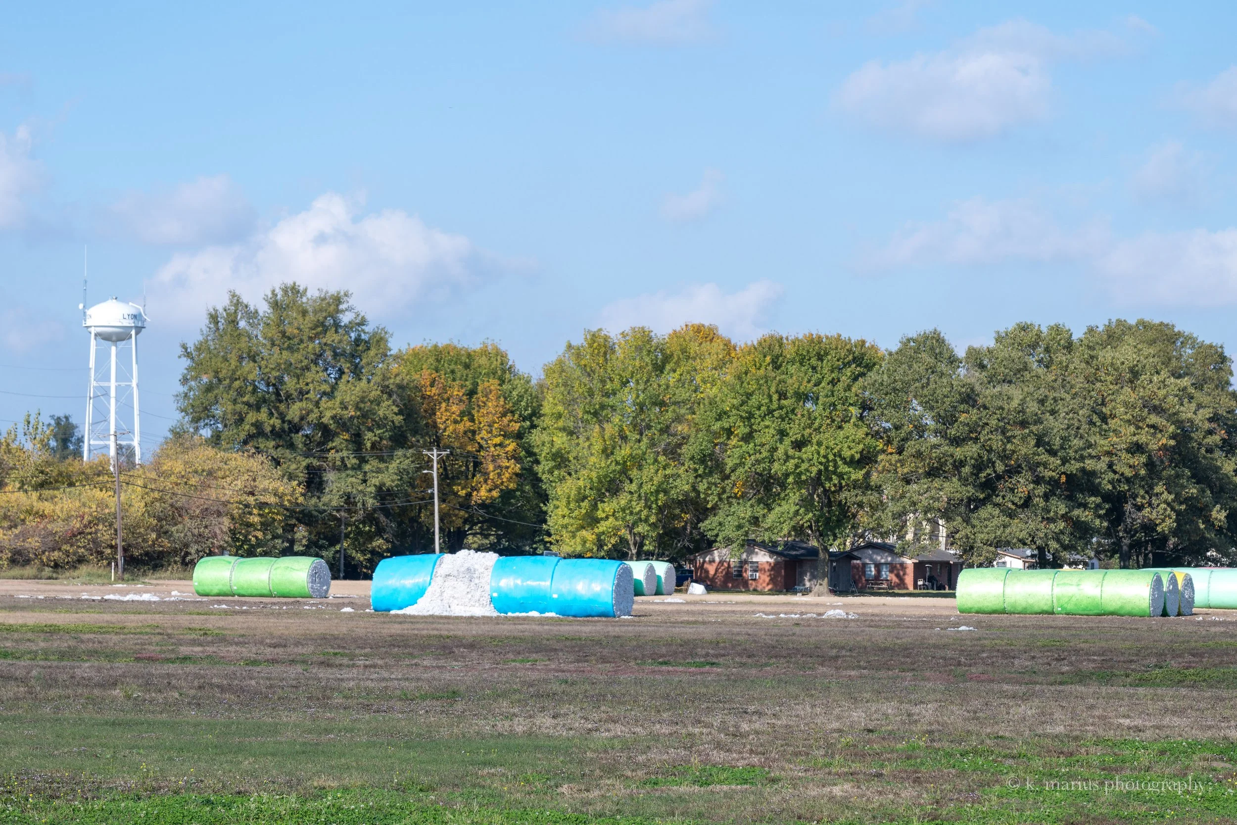 Cotton bales and Lyon water tower