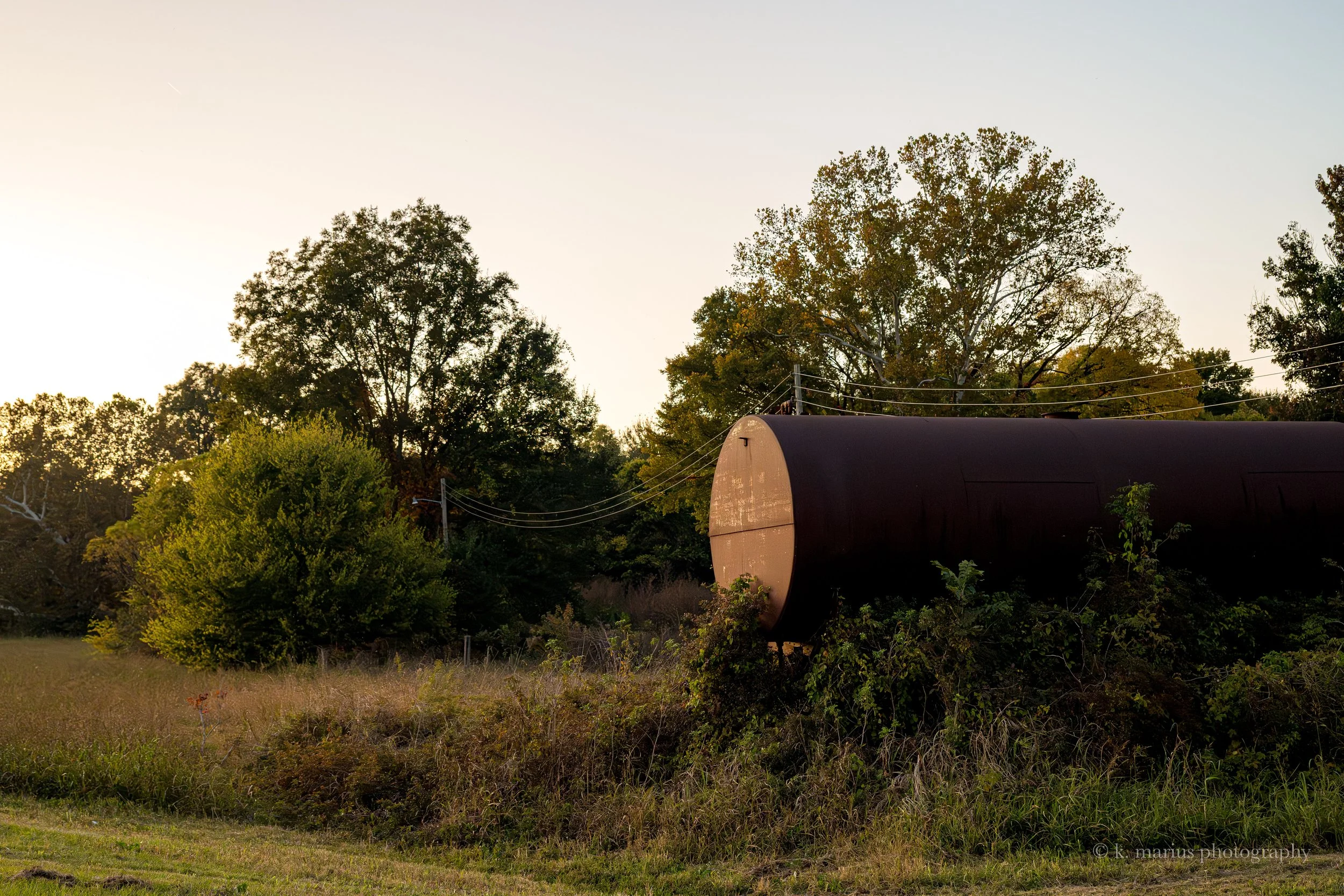 Old rusty tanker at sunset, US Hwy 61, south Rolling Fork.