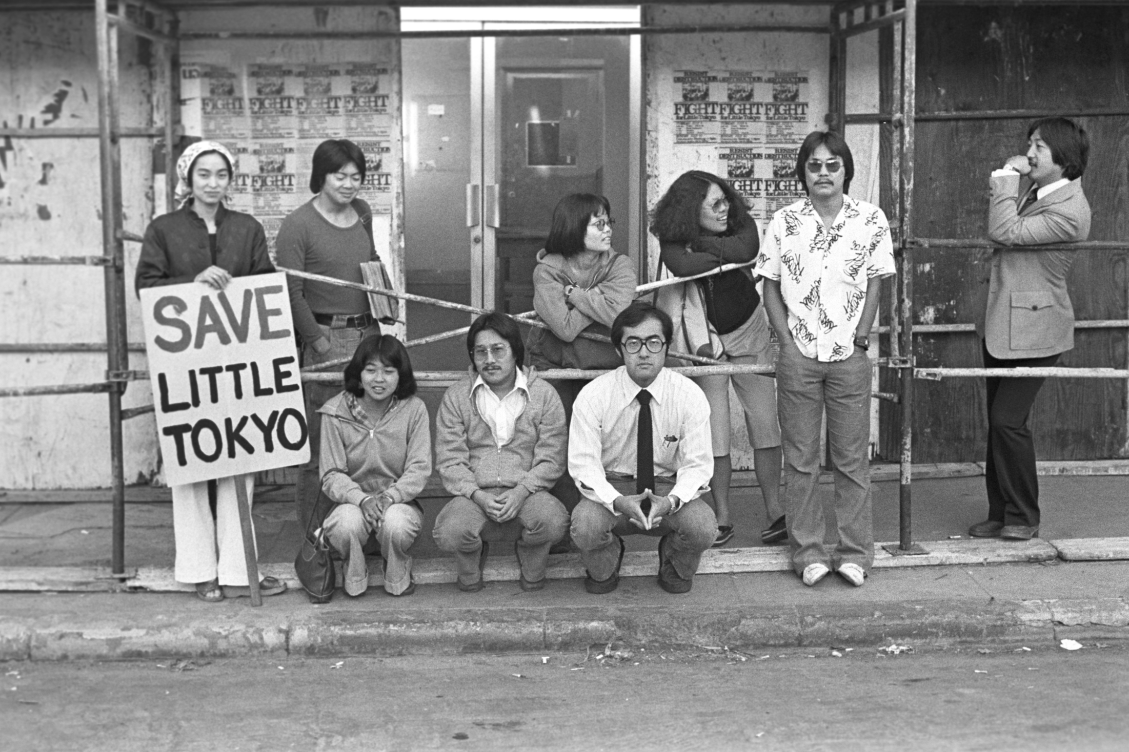Hell No! We Won’t Go!
Members of the Little Tokyo People’s Rights Organization are seen
picketing in front of one of the soon-to-be-demolished storefronts on Weller Street. From left: Joanne Sakai, Alan Kondo, Lucien Kubota, Dean Toji, Evelyn Yoshimu