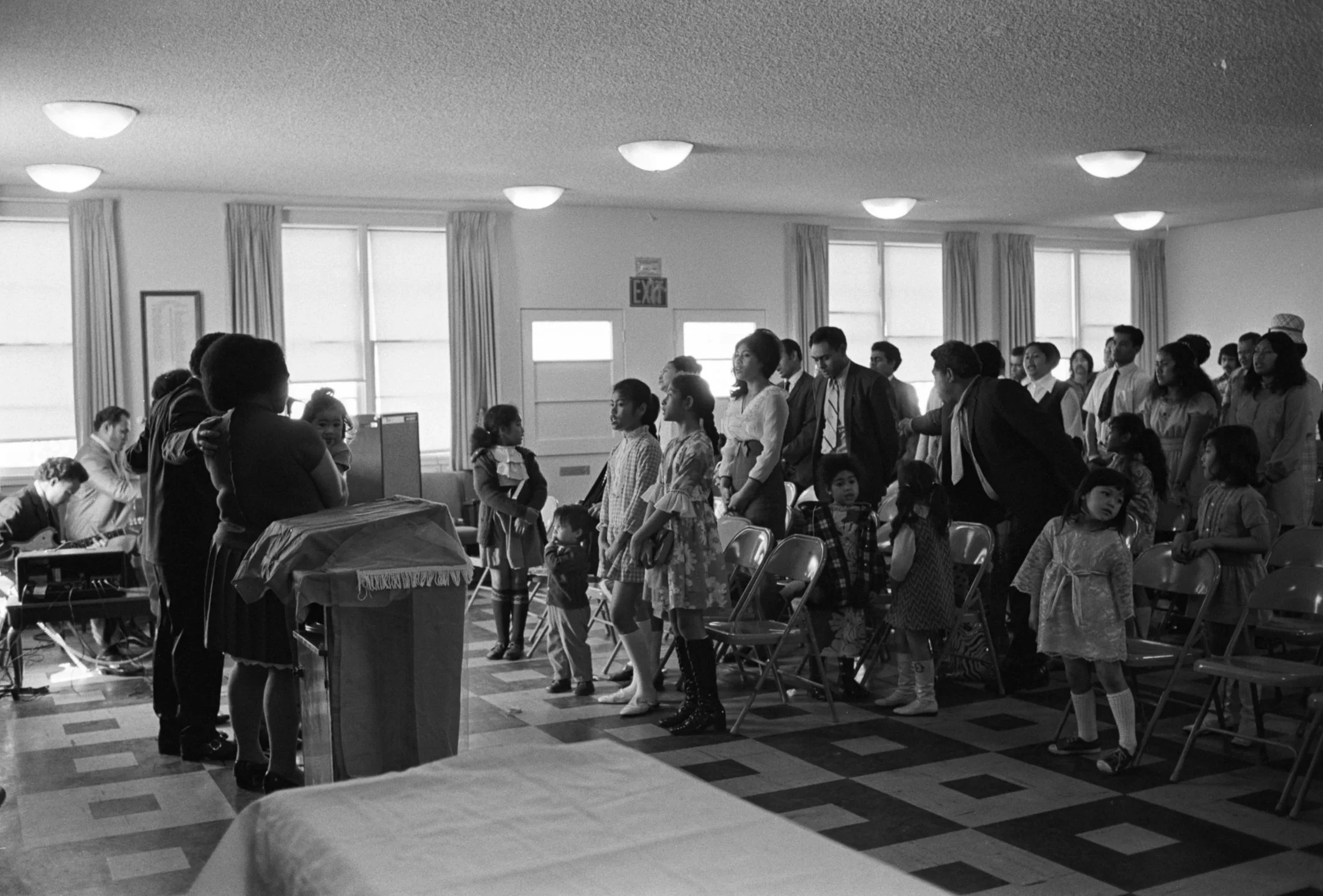 Congregation Standing During Service (1972),
(Samoan Church Service) Members of the congregation standing during service.
Photographed by Alan Ohashi