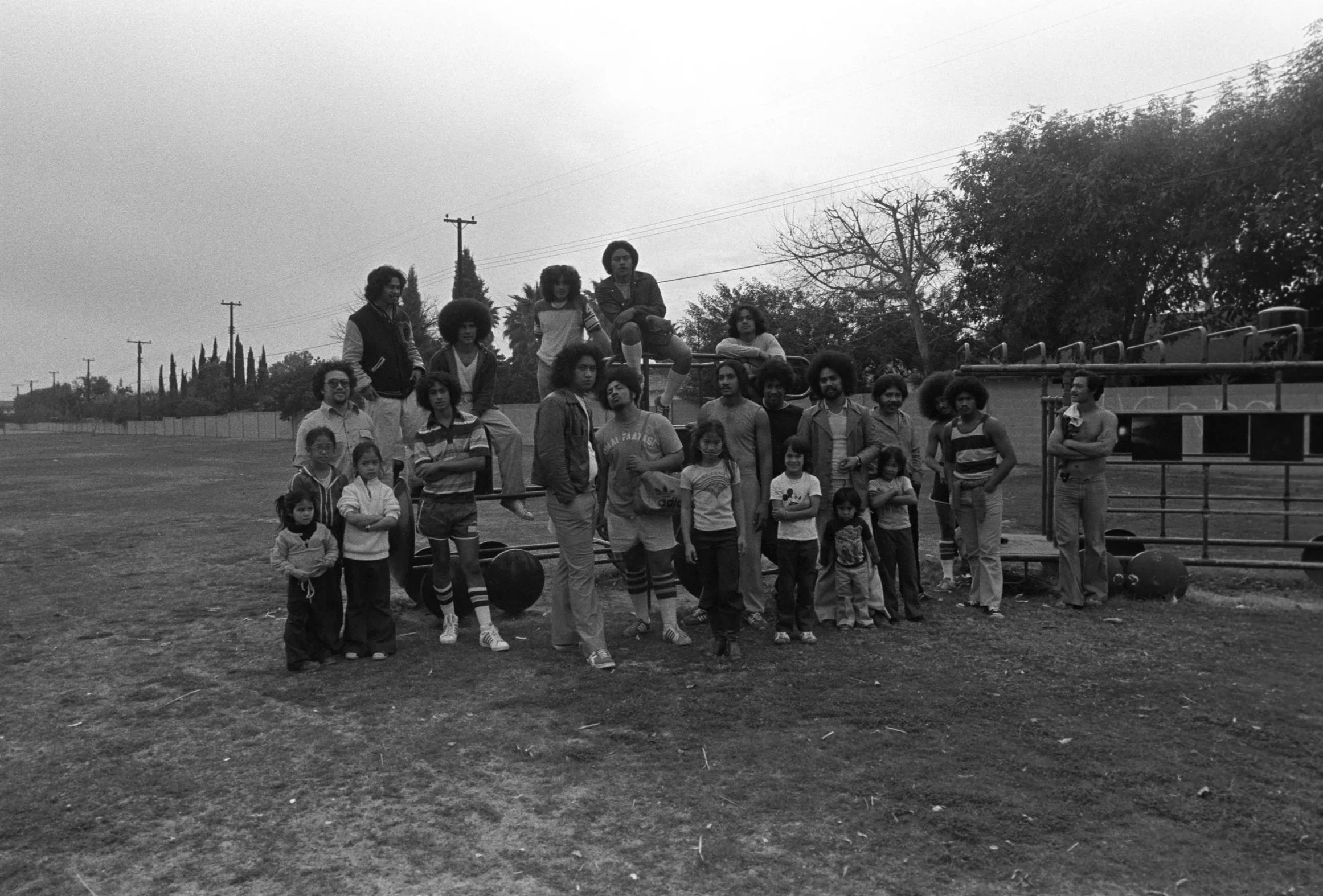 Group Photo at a Carson Playground for Omai Fa'atasi Film (1972),
A group of adults and children at a Carson Playground for the film Omai Fa'atasi.
Photographed by Visual Communications