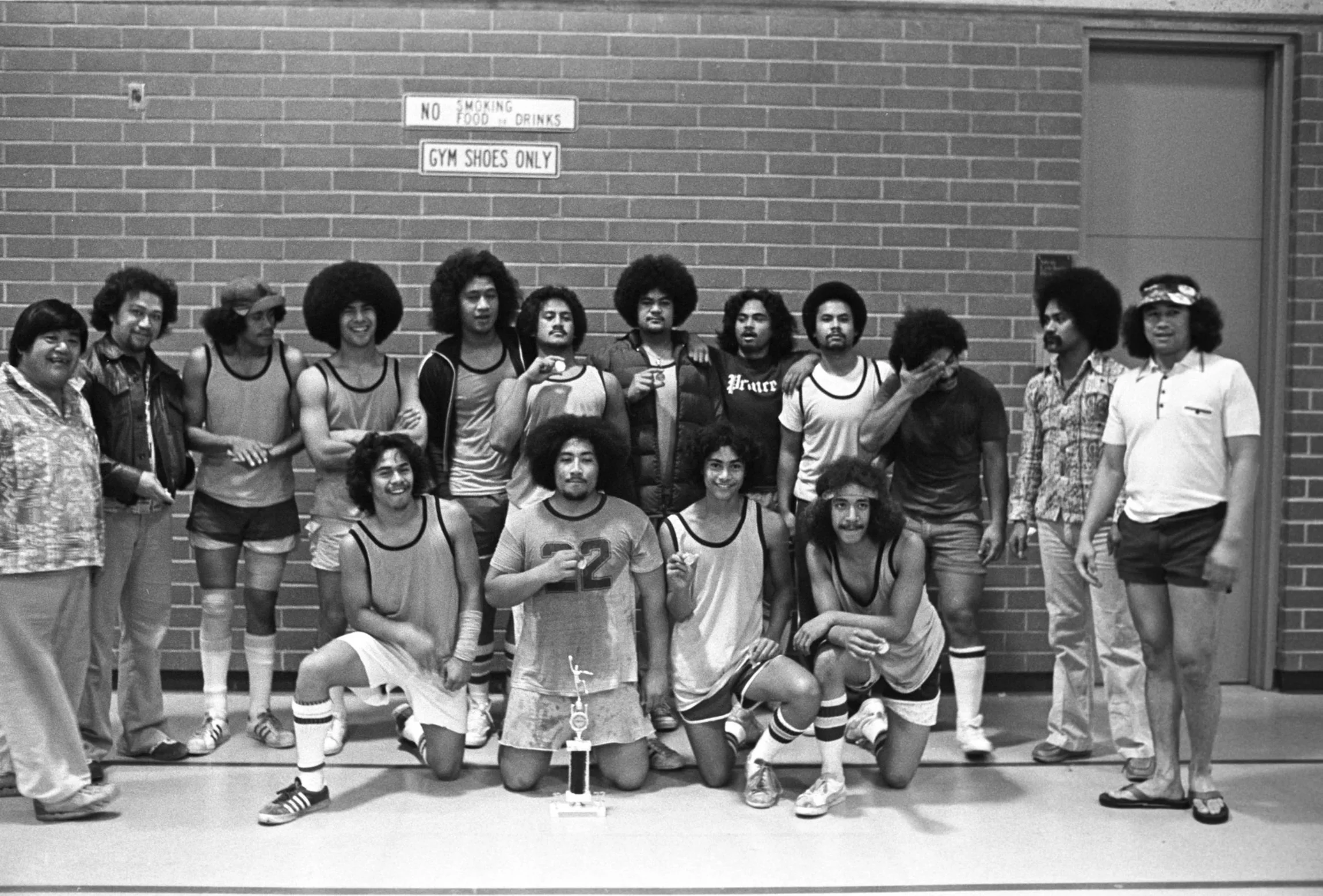 Team and Coach With Trophy (1977-1978),
The winning team with their trophy and coach.
Photographed by Visual Communications