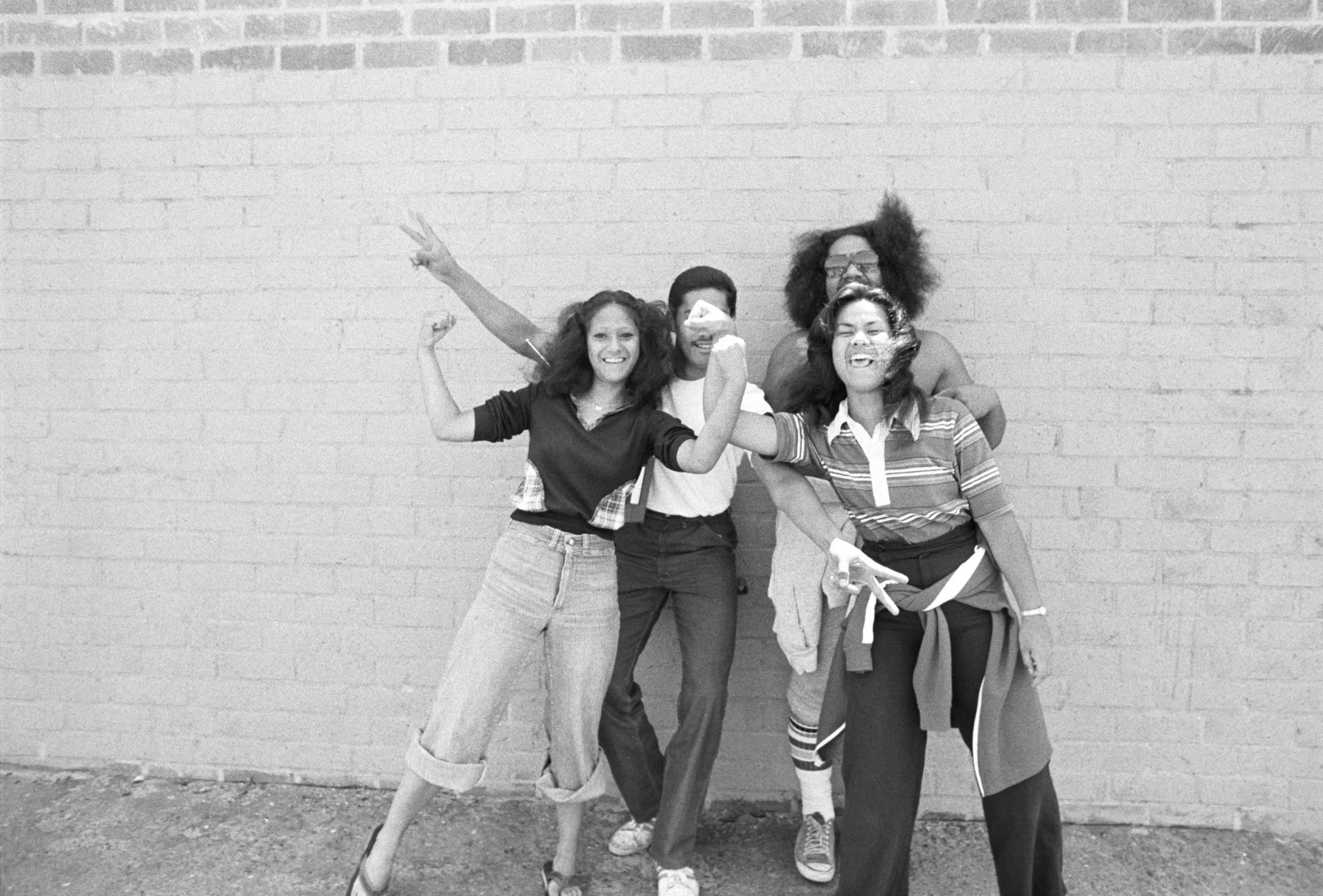 Posing Outside Omai Office (1977-1978),
Four people posing outside the Omai Headquarters in Carson.
Photographed by Visual Communications