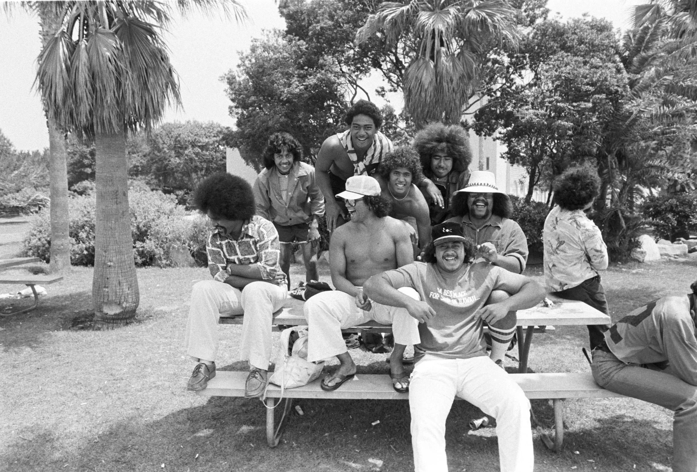 People Laughing on Park Table (1980),
A group of people laughing sitting on top of a bench table.
Photographed by Visual Communications