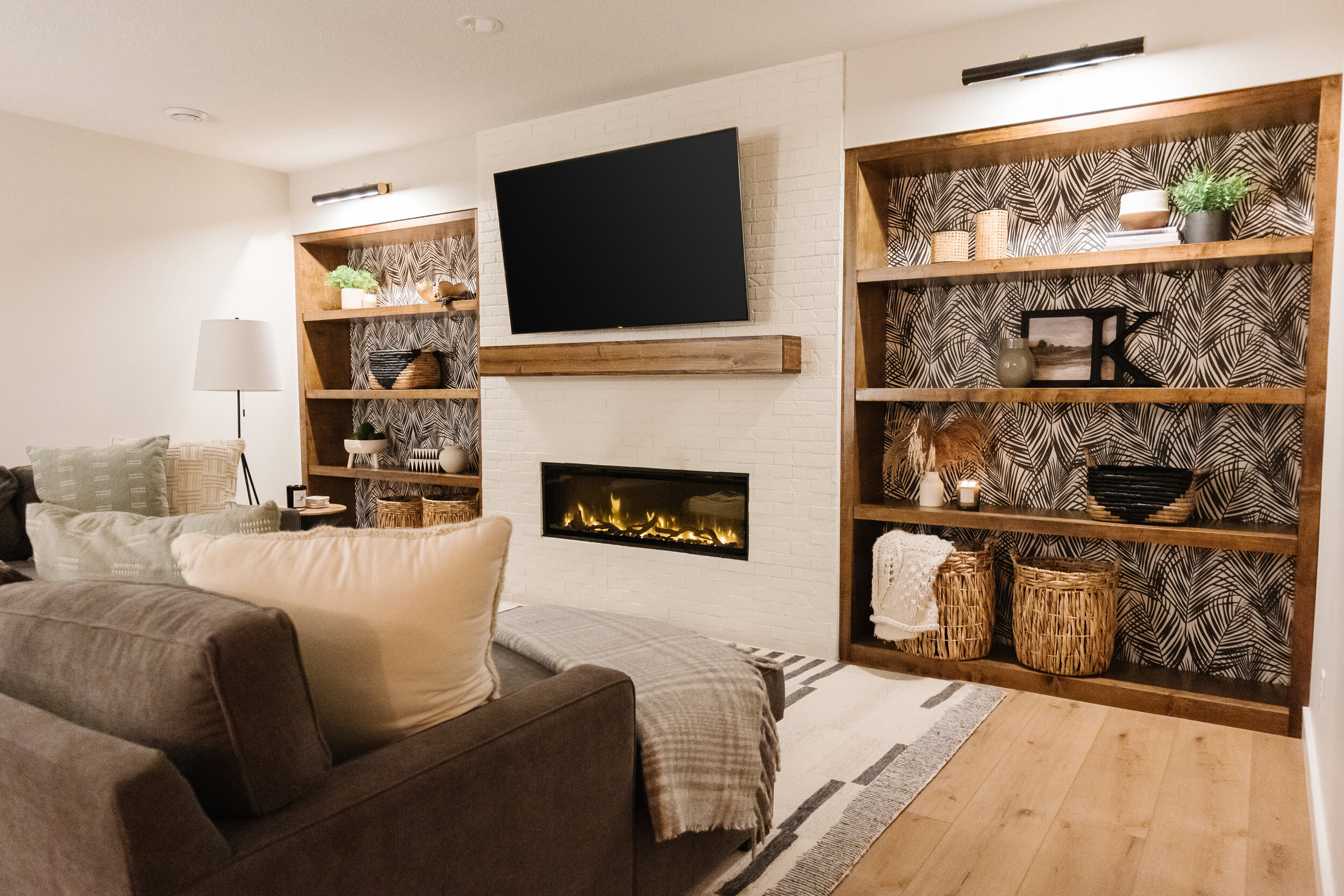 basement living room with fireplace