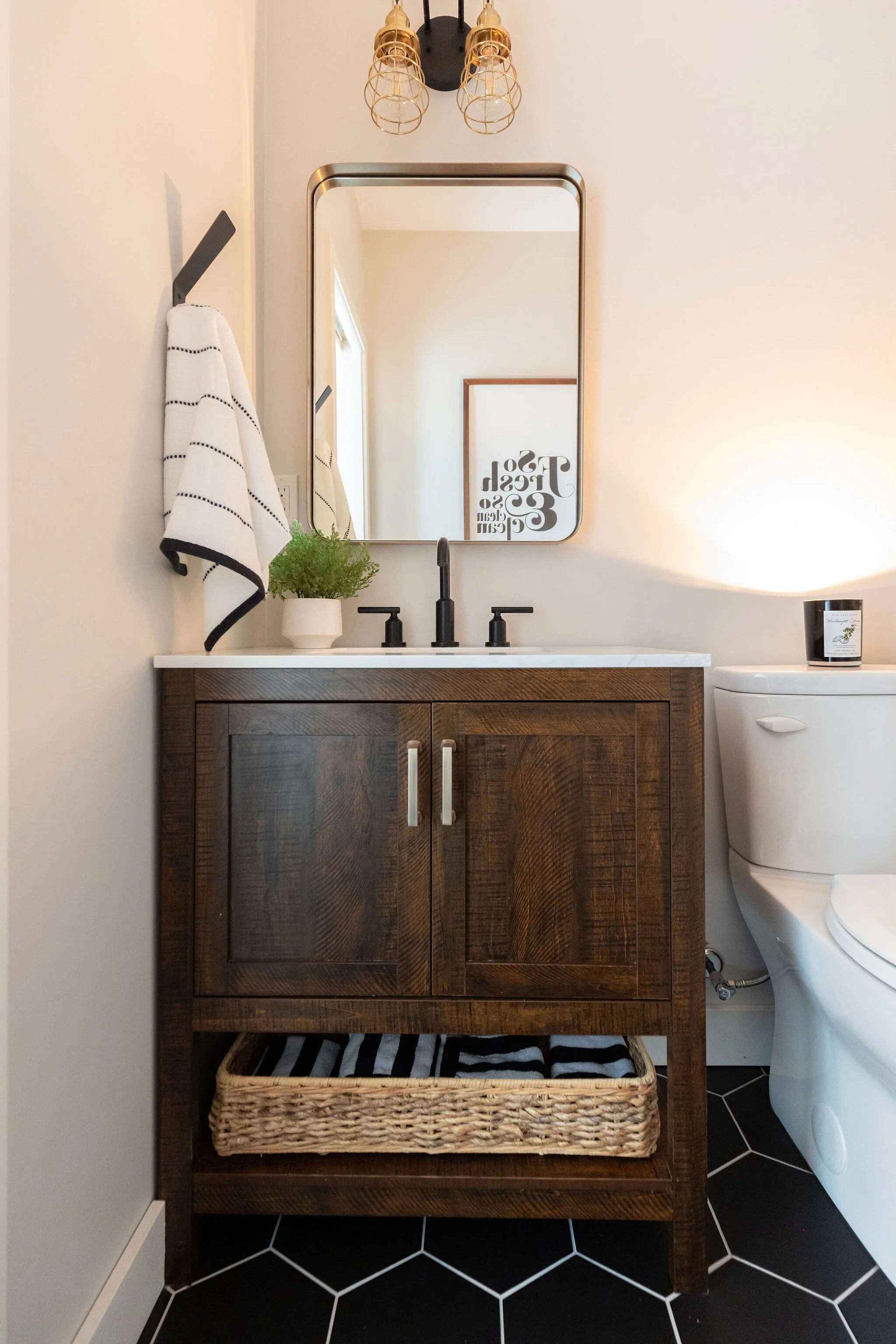 bathroom with warm wood vanity