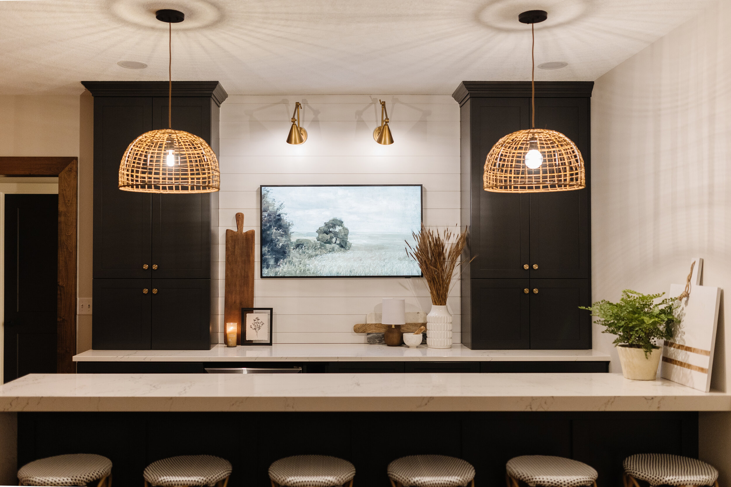 front view of bar with hanging woven pendant lights 