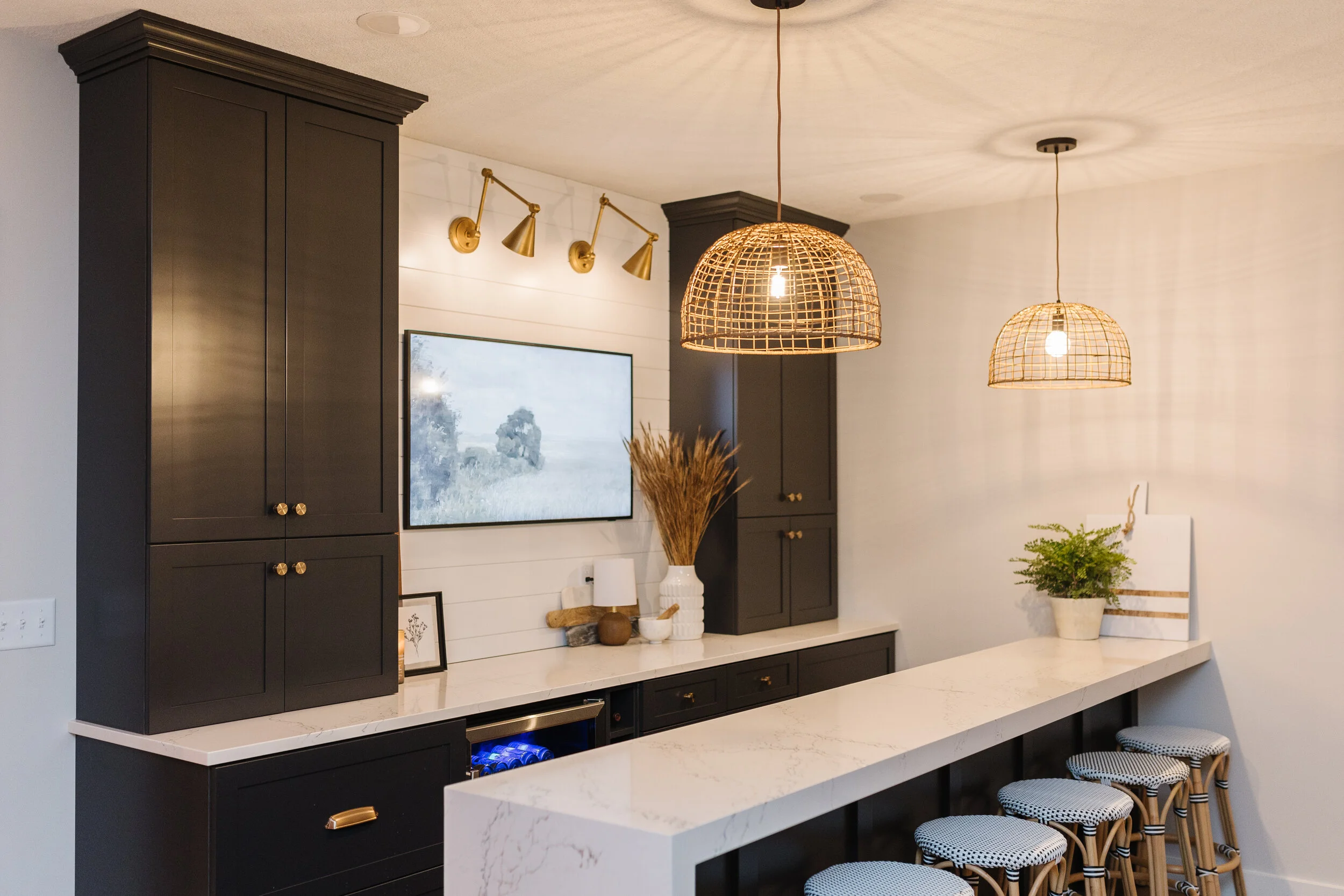 
side view of bar with black cabinetry