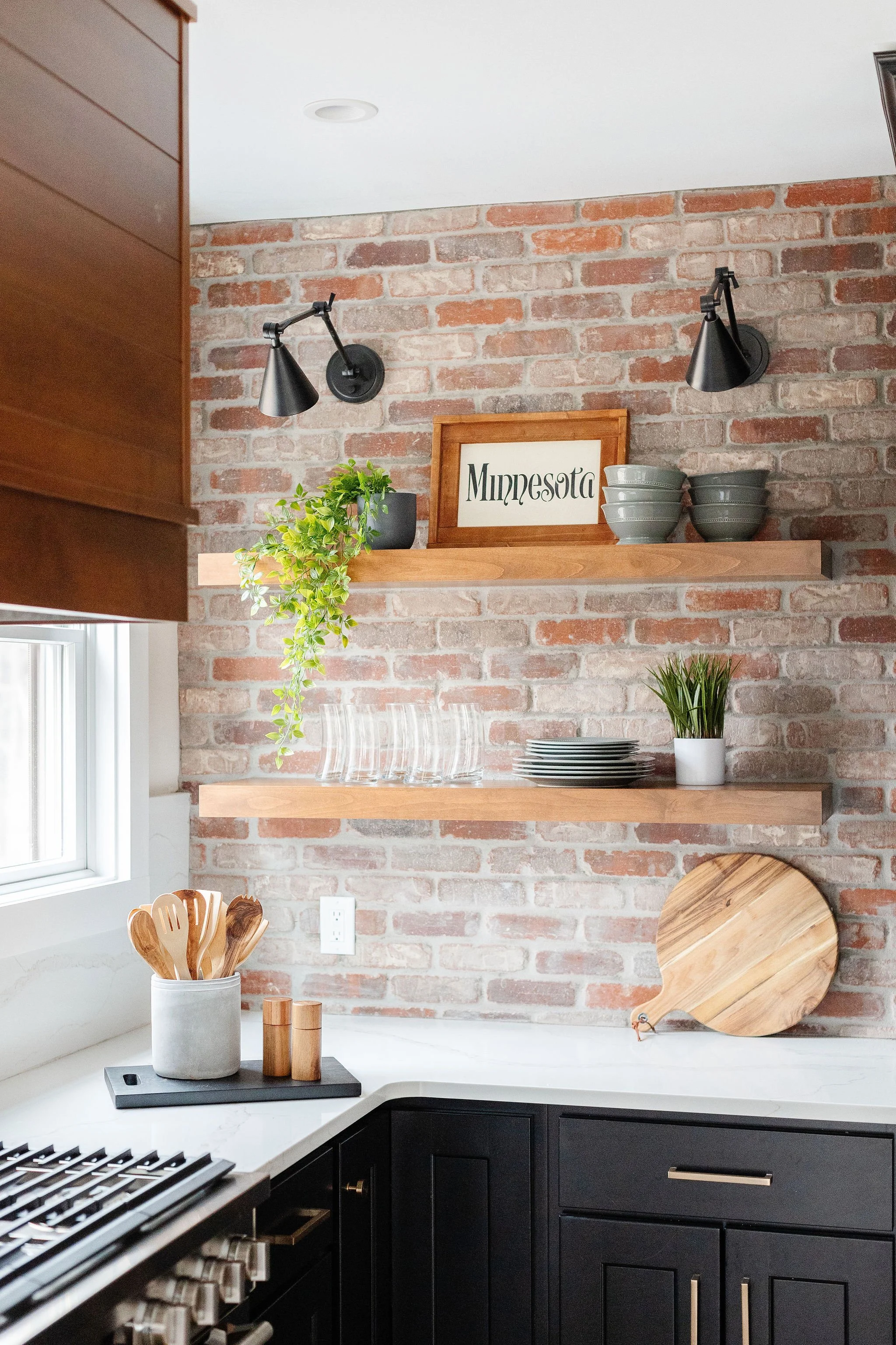 brick accent with open shelving kitchen