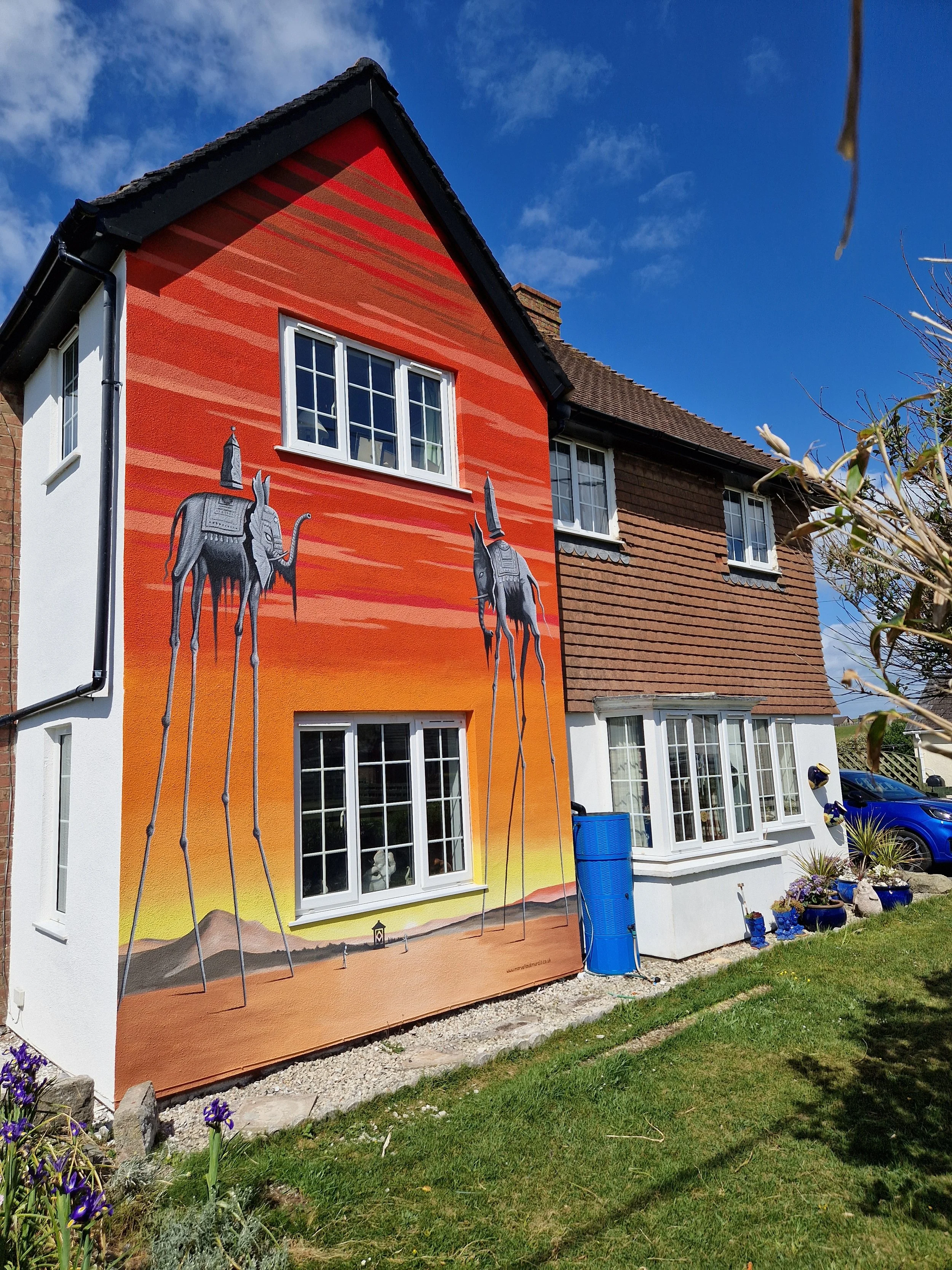 This client wanted their favourite painting - Elephants by Salvador Dali - painted on the front of their house.