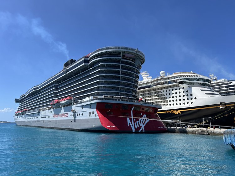Two cruise ships docked in port at sunset
