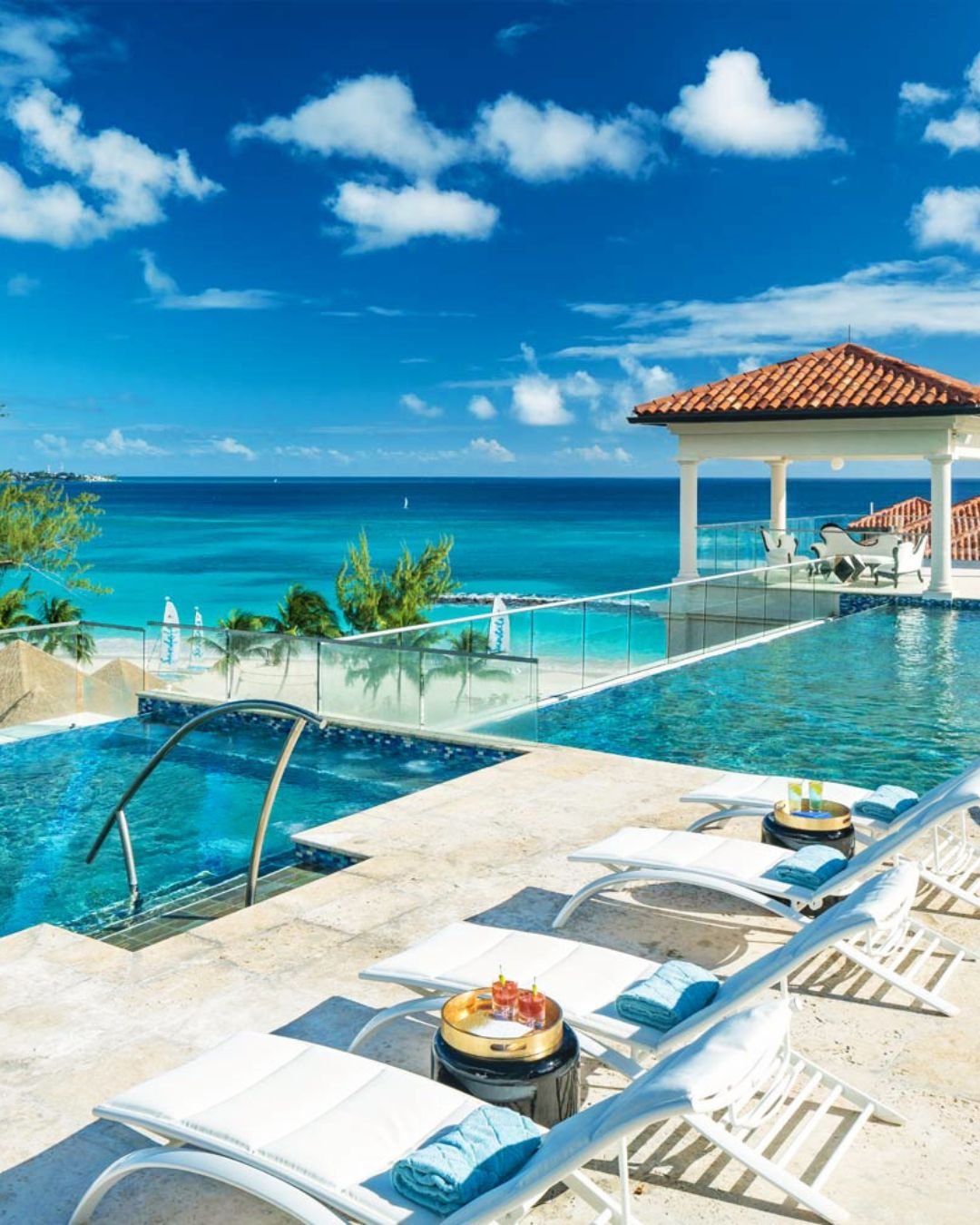 Trade the everyday for sun-kissed shores and let your love story unfold where the ocean meets paradise 🌊☀️

Imagine waking up to endless turquoise views from your private terrace built for two, the gentle Caribbean breeze drifting through the air as