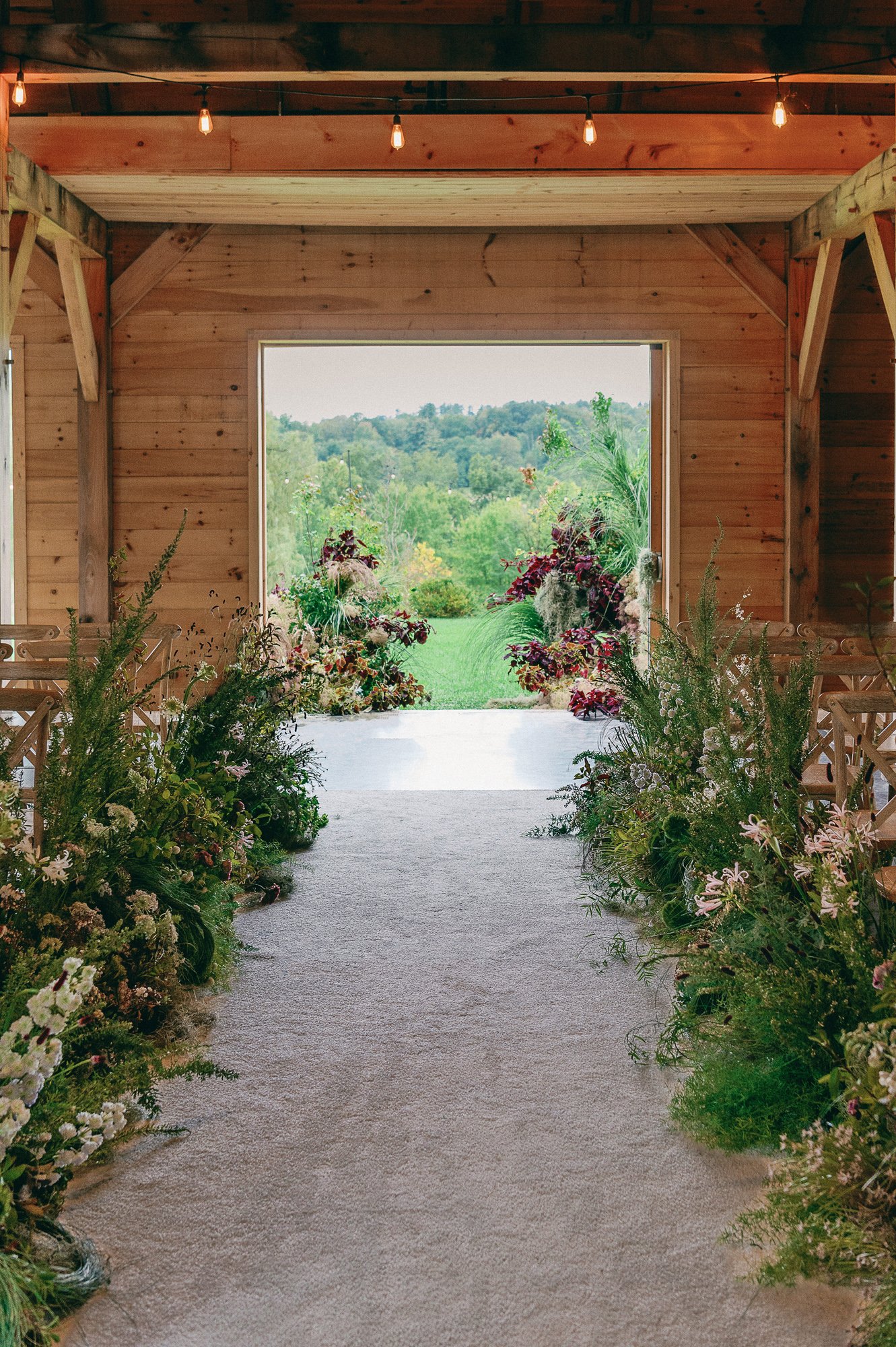 Indoor Ceremony Wedding Flowers at Event Barn at Inness in Accord, NY
