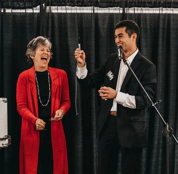 Guest reacting during Brady Lee's magic performance