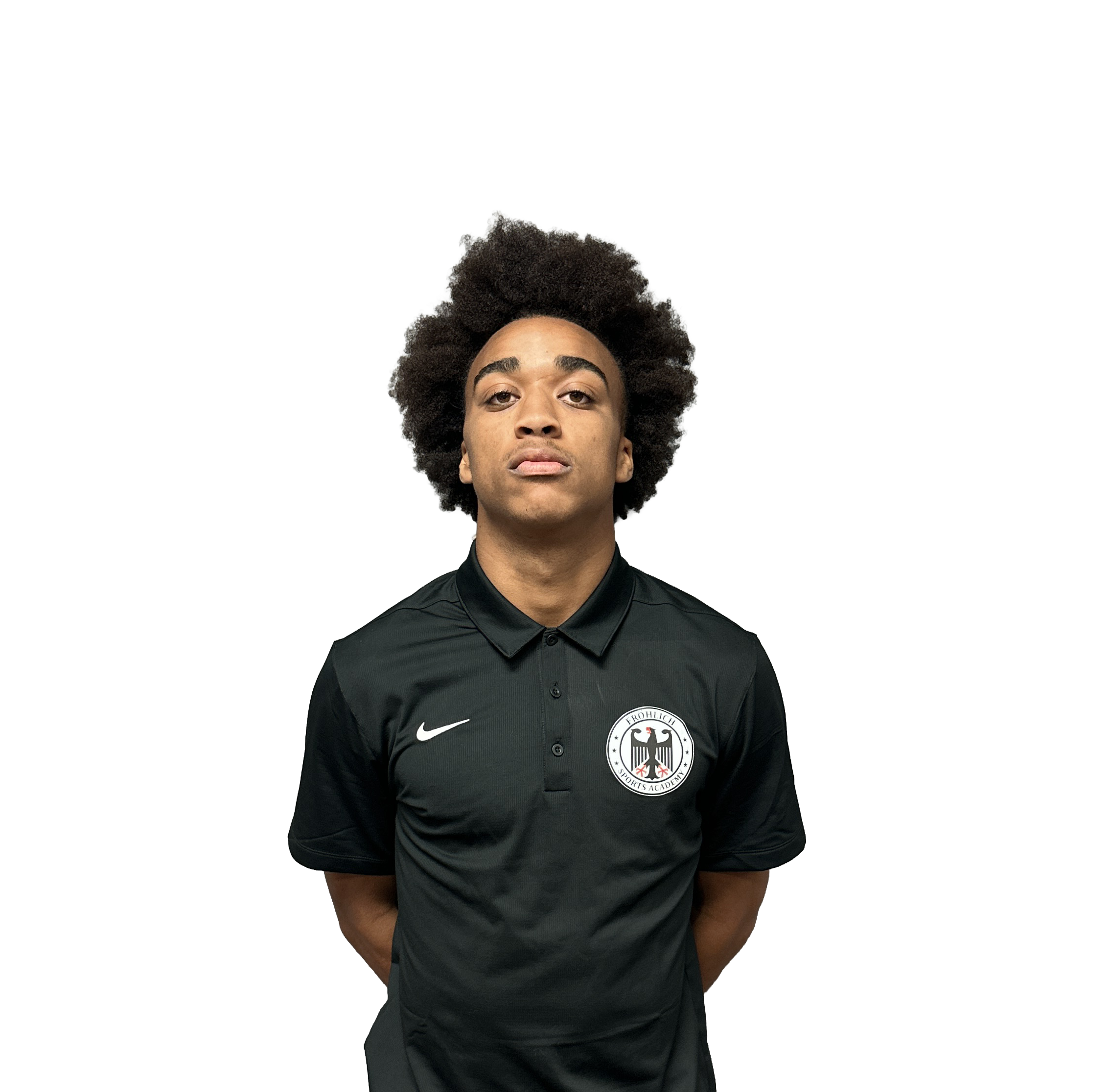 A young man with brown skin and curly dark hair wearing a black sports jersey with a German Football Federation logo and Nike logo.