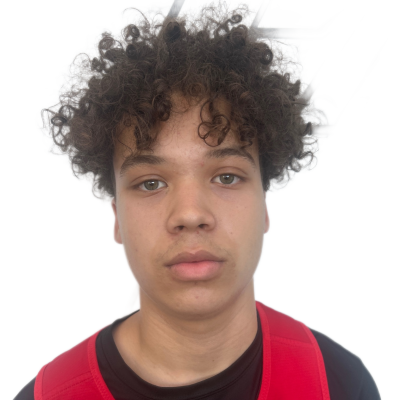 Young boy smiling, wearing a black t-shirt and red sports jersey with 'FROHLICK' written on it.