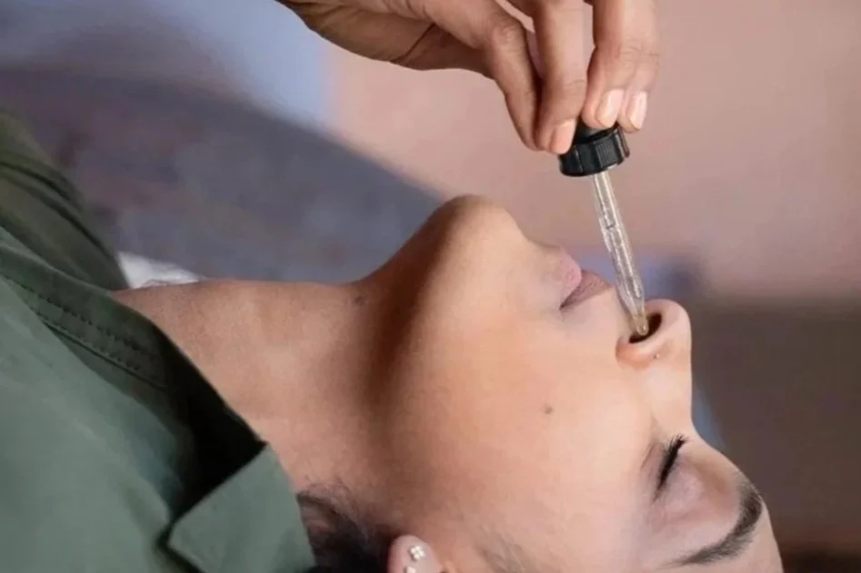 Dr. Rina Kansagra Fisher performing a clinical Ayurvedic Nasya treatment in Santa Fe.
