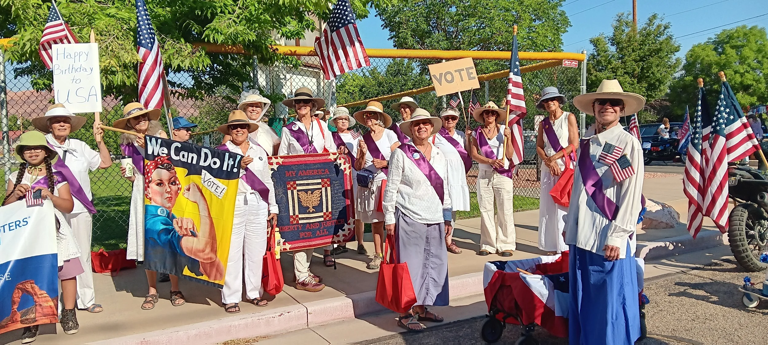 July 4 2026: 18 walkers, aged 10 to ???? We handed out 165 frisbee/fans, hundreds and hundreds of 411 cards, copies of the constitution, and flags! Lots of positive attention and cheers too! 
