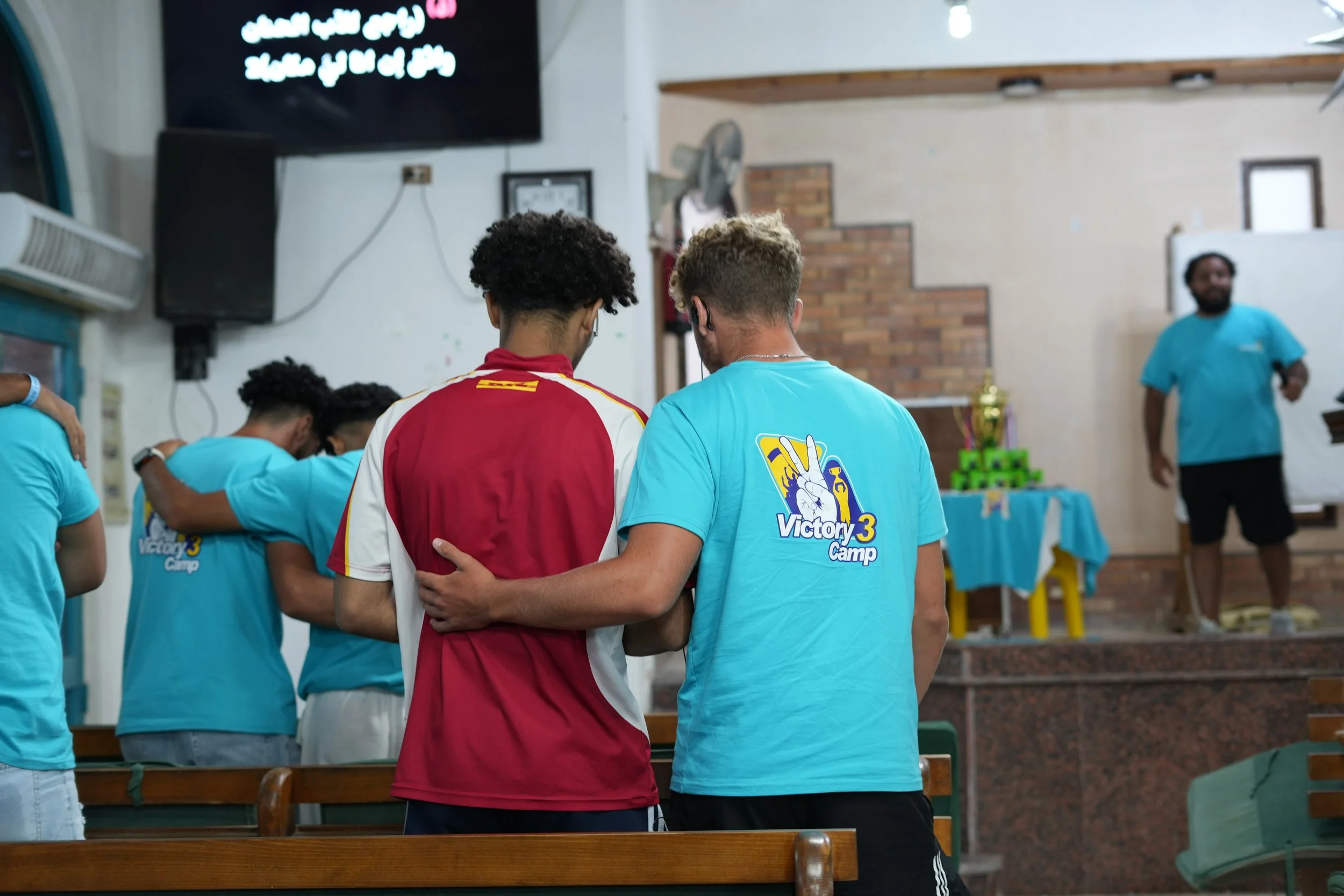 Isaiah and friend praying.jpeg