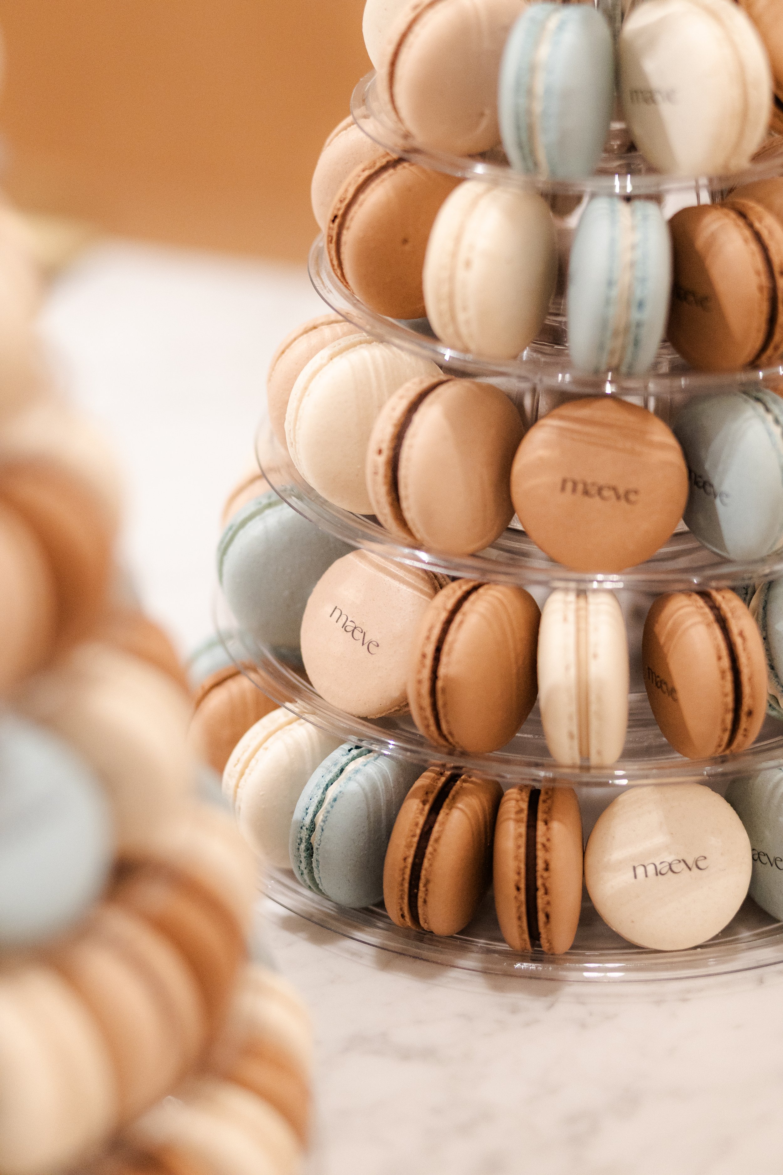 Macaron tower with Maeve custom print, brown, beige and blue macarons