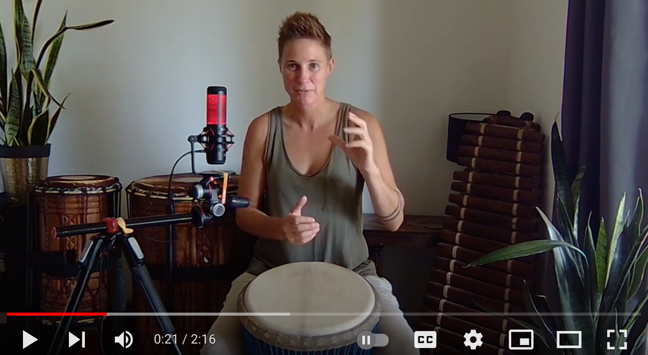 Hands playing a drum