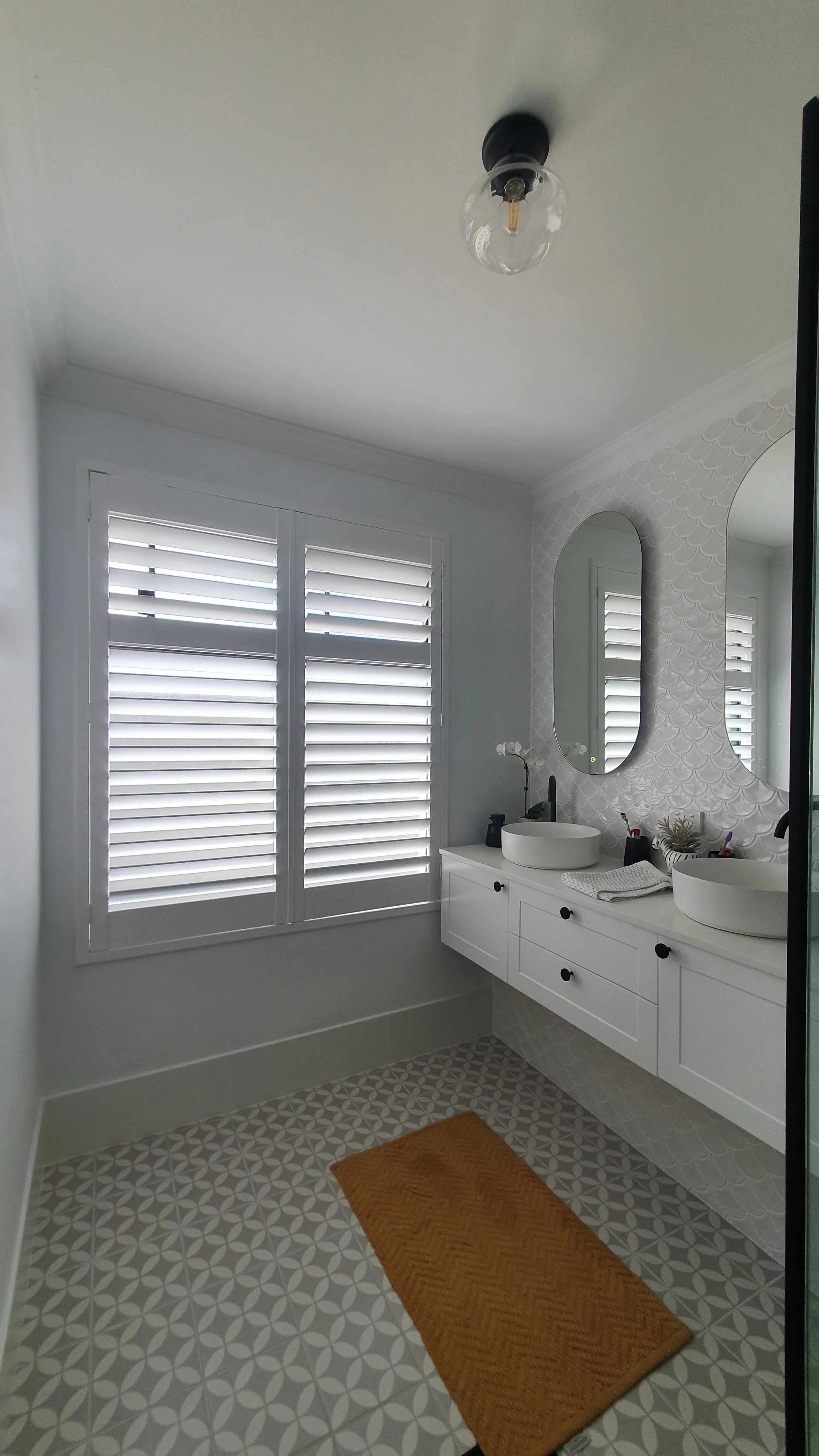 PolySatin Plantation Shutters allowing privacy, airflow and light control in a modern Perth bathroom