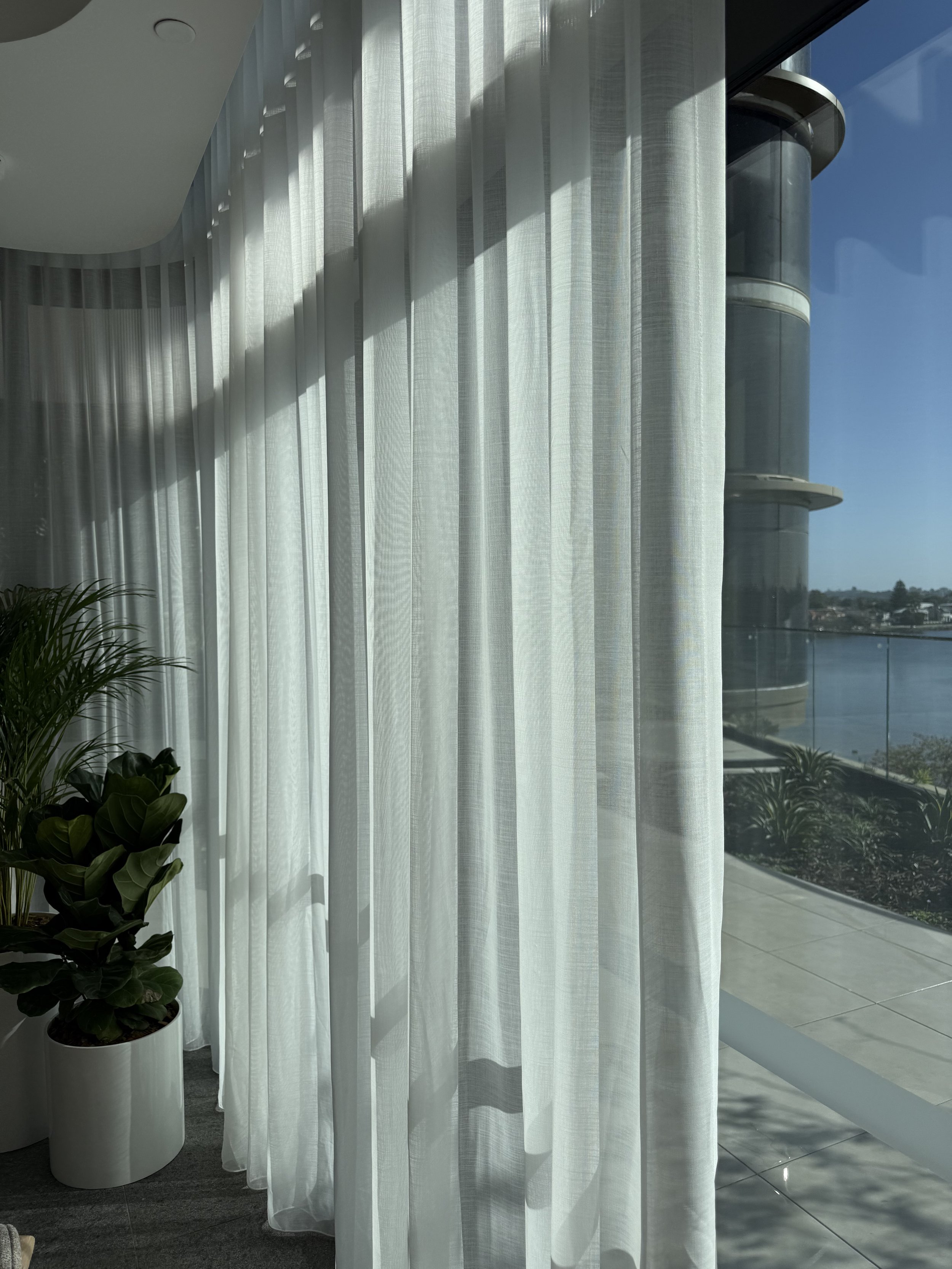 S-Wave sheer curtains Perth living room angled view showing soft folds