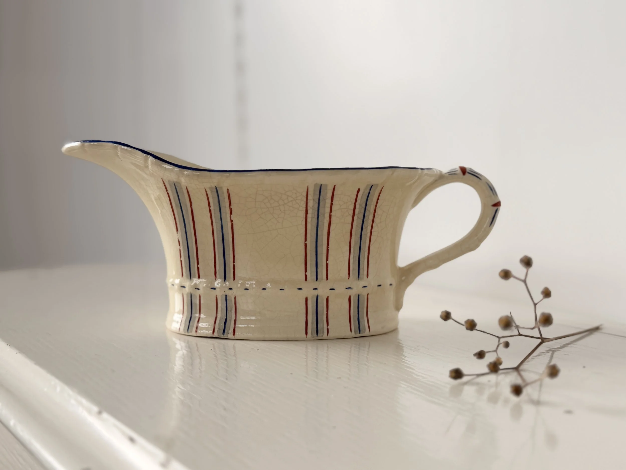 Honest, unretouched photo of a 1930s English pottery piece with a charming weathered finish for home decor.