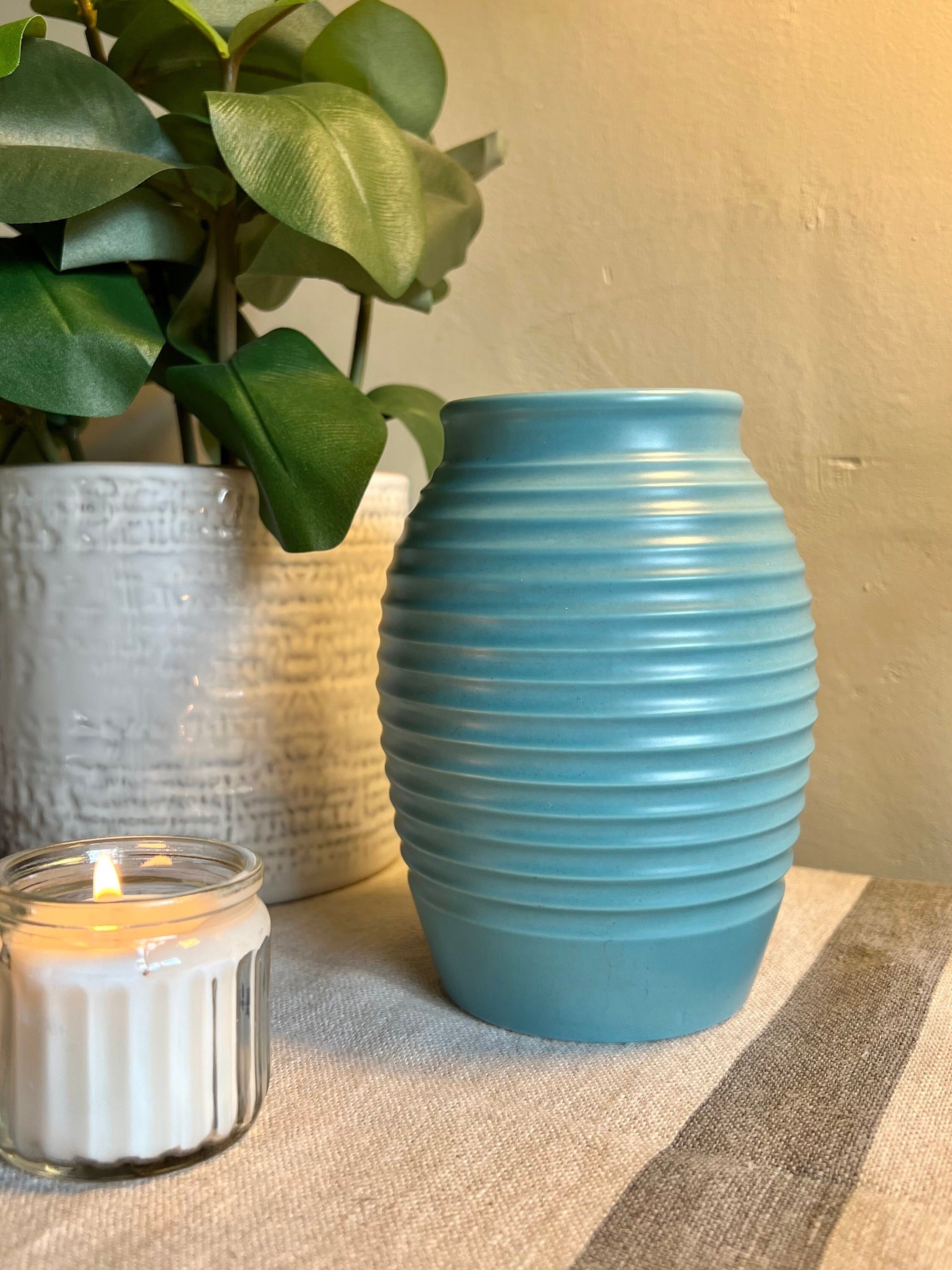 A very rare Keith Murray for Wedgwood lathe turned turquoise blue grenade vase