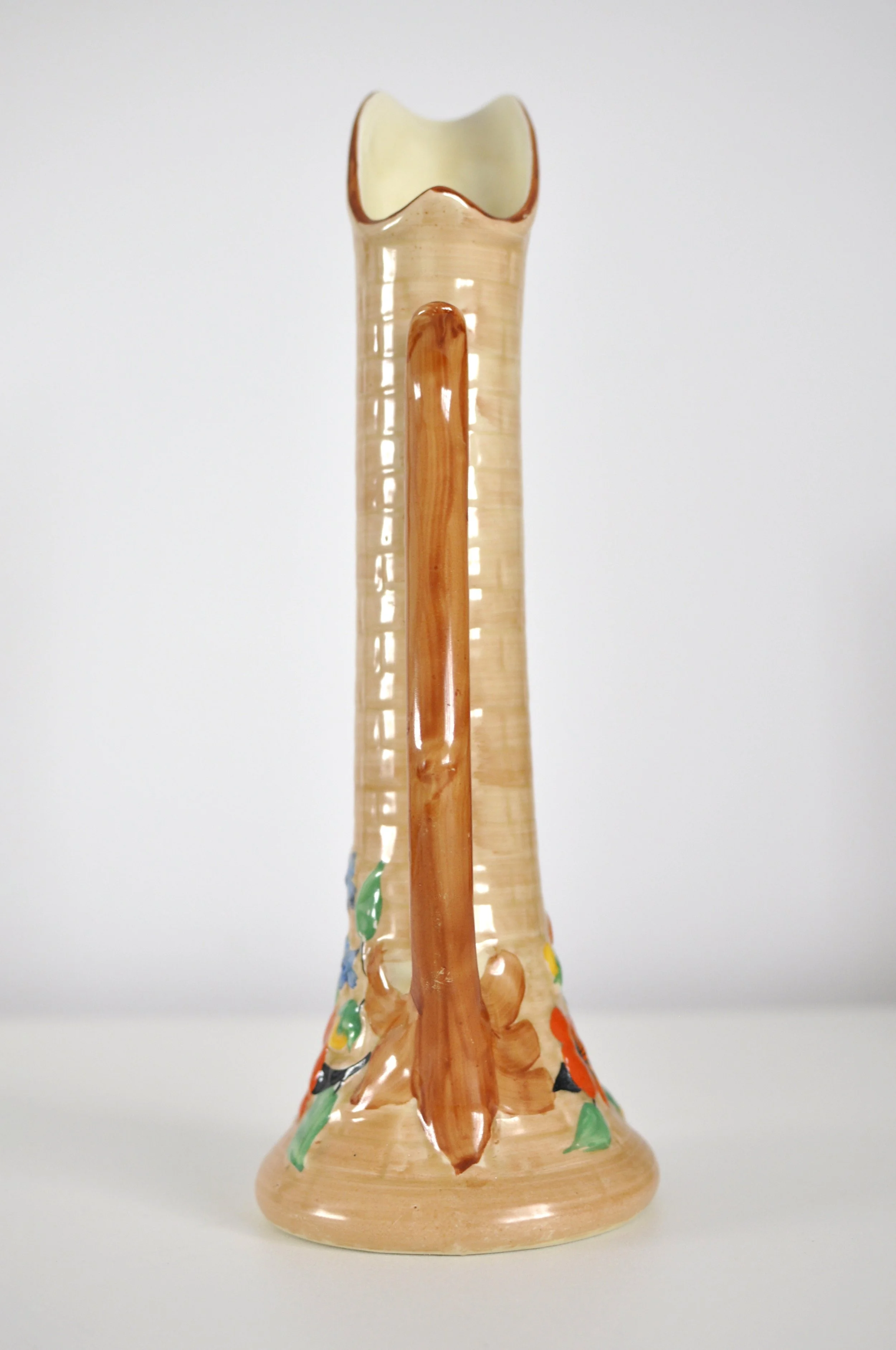 Sculptural 33cm tall HJ Woods flower vase with branch-style handle.