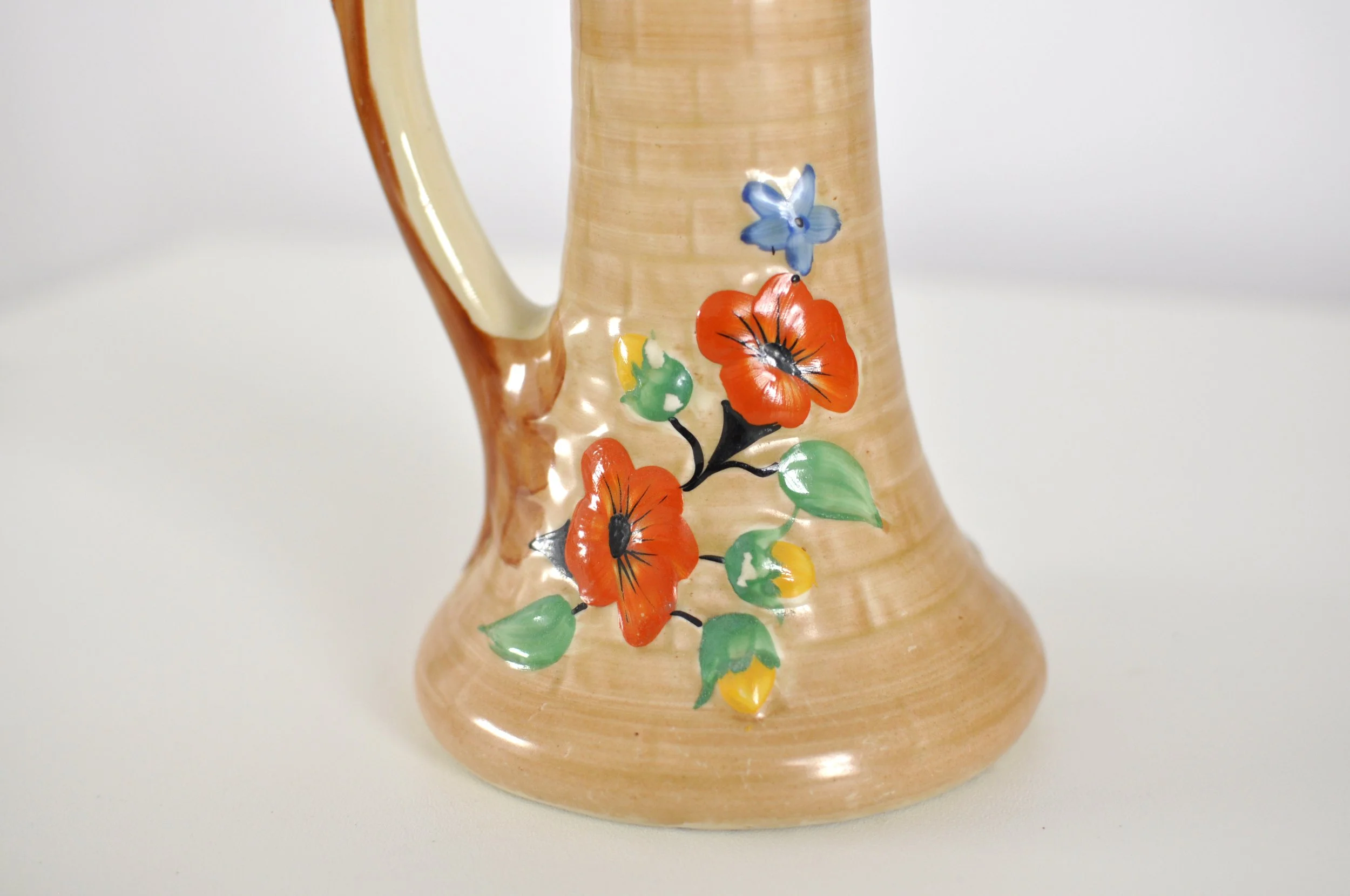 Close-up of cottage garden flower sprigs on vintage Burslem pottery.