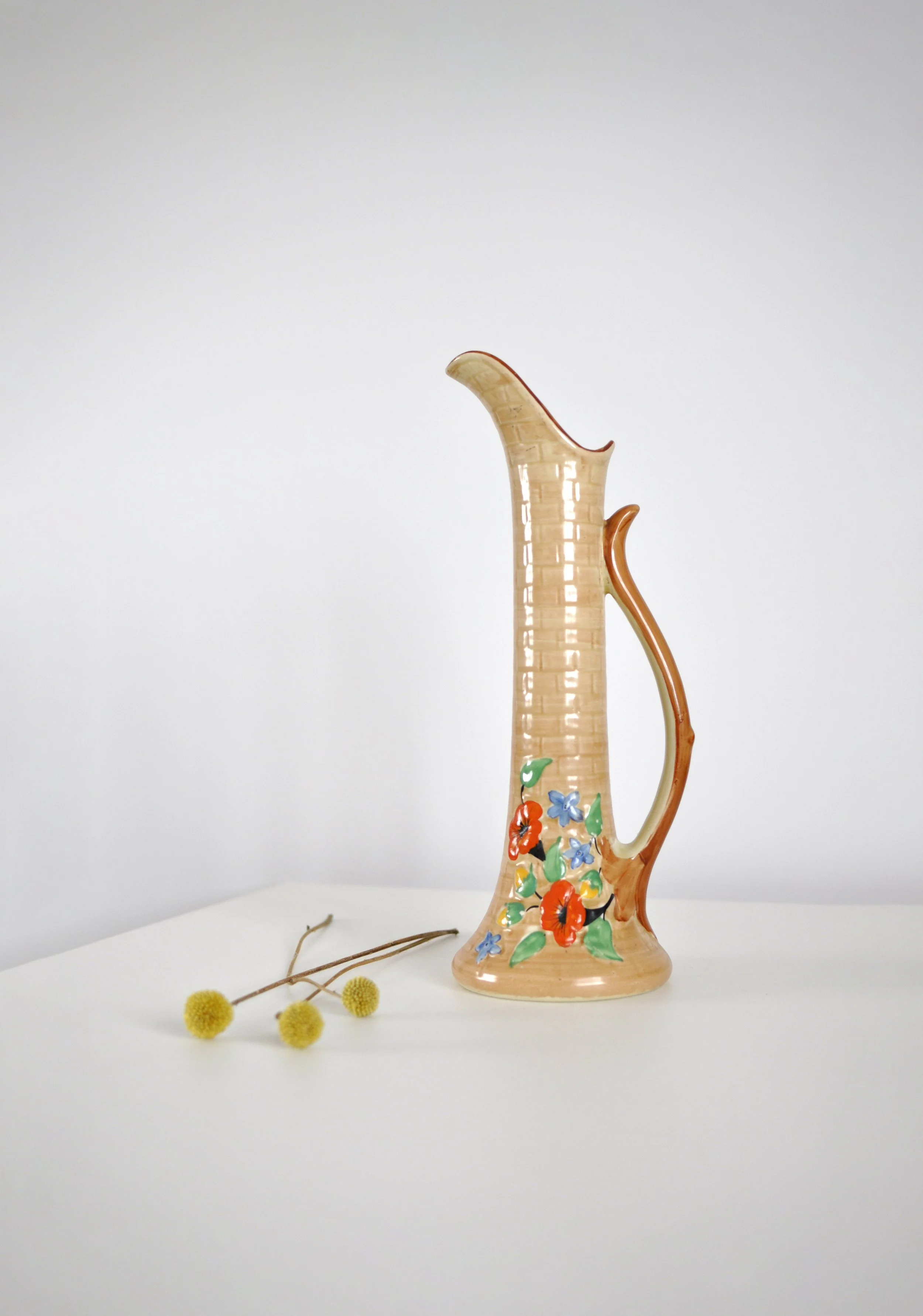 Large 1950s HJ Woods hand-painted floral jug with brick texture.