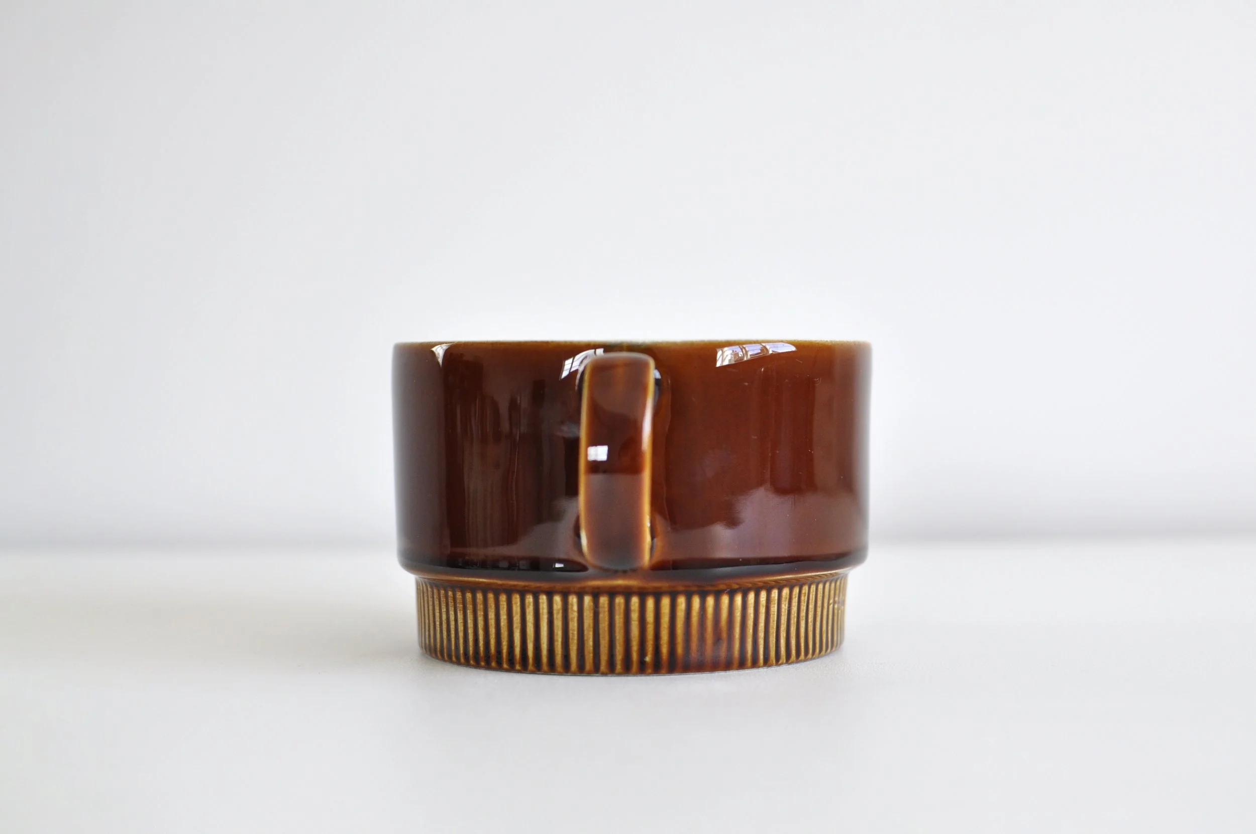 Close-up of the warm brown gloss glaze on a 1960s Poole Pottery jug.