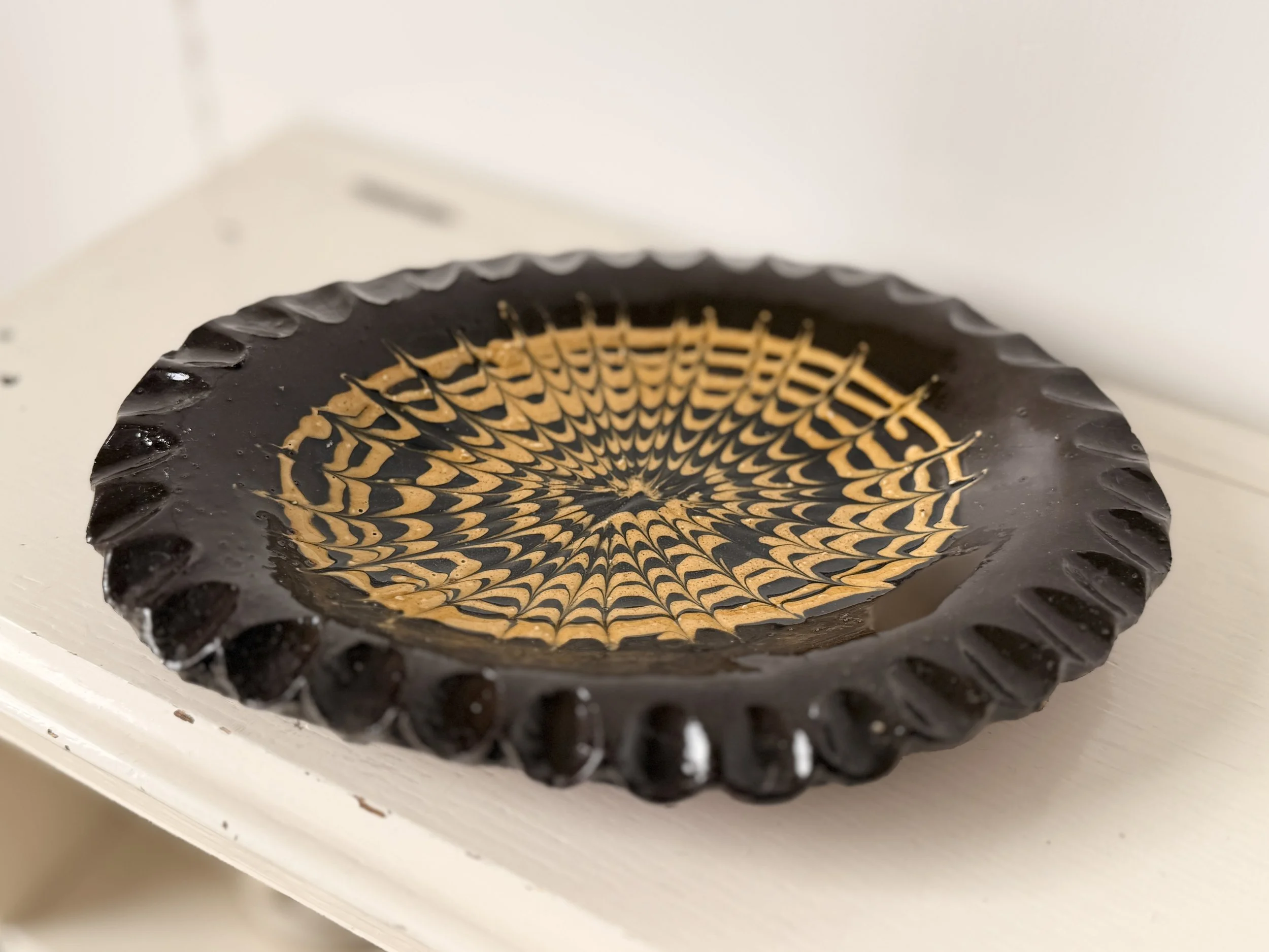 Large hand-thrown slipware studio pottery oval platter with a neutral cream glaze.