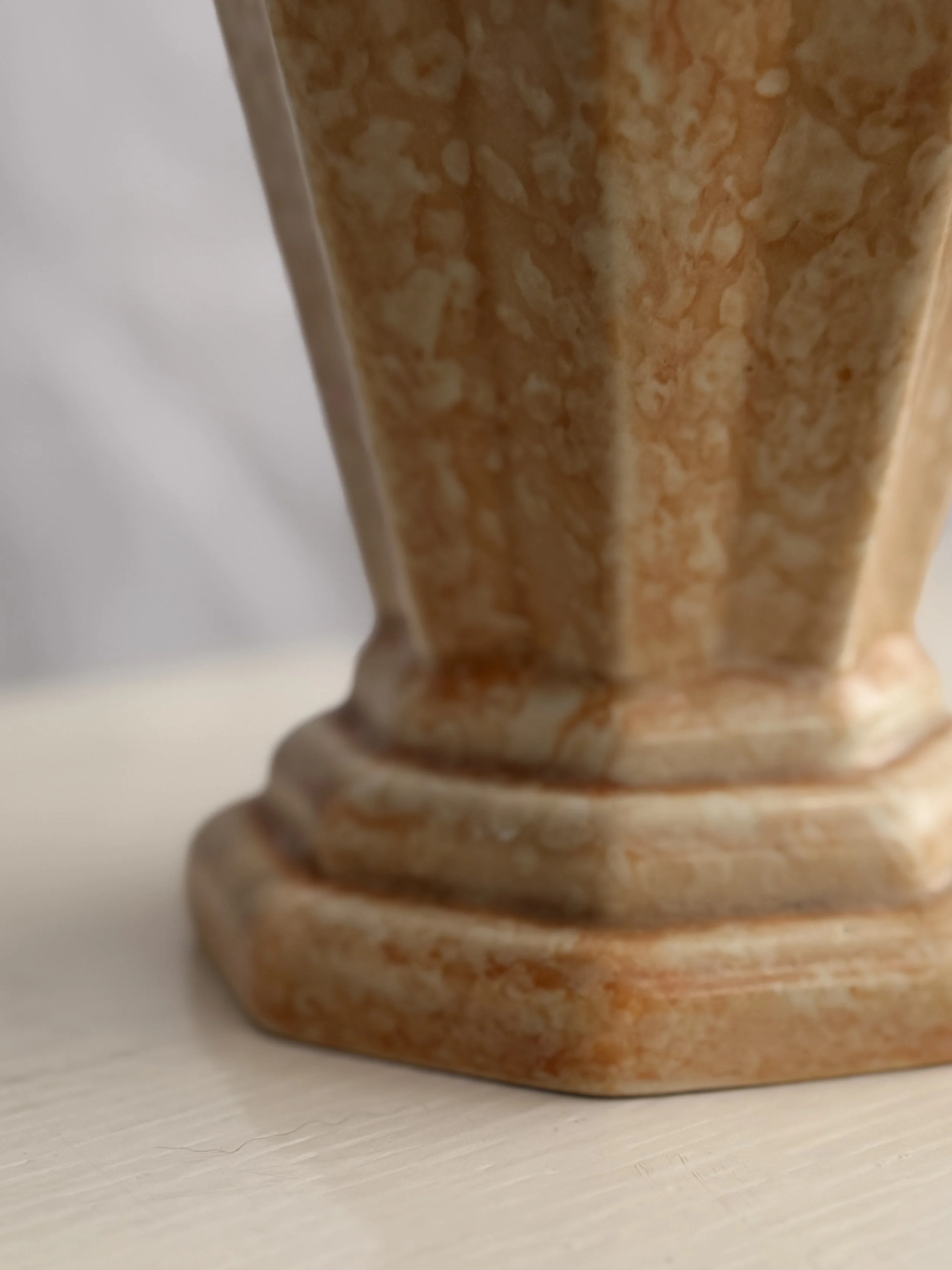 The subtle texture and vintage patina of a Crown Devon Art Deco collector's piece.