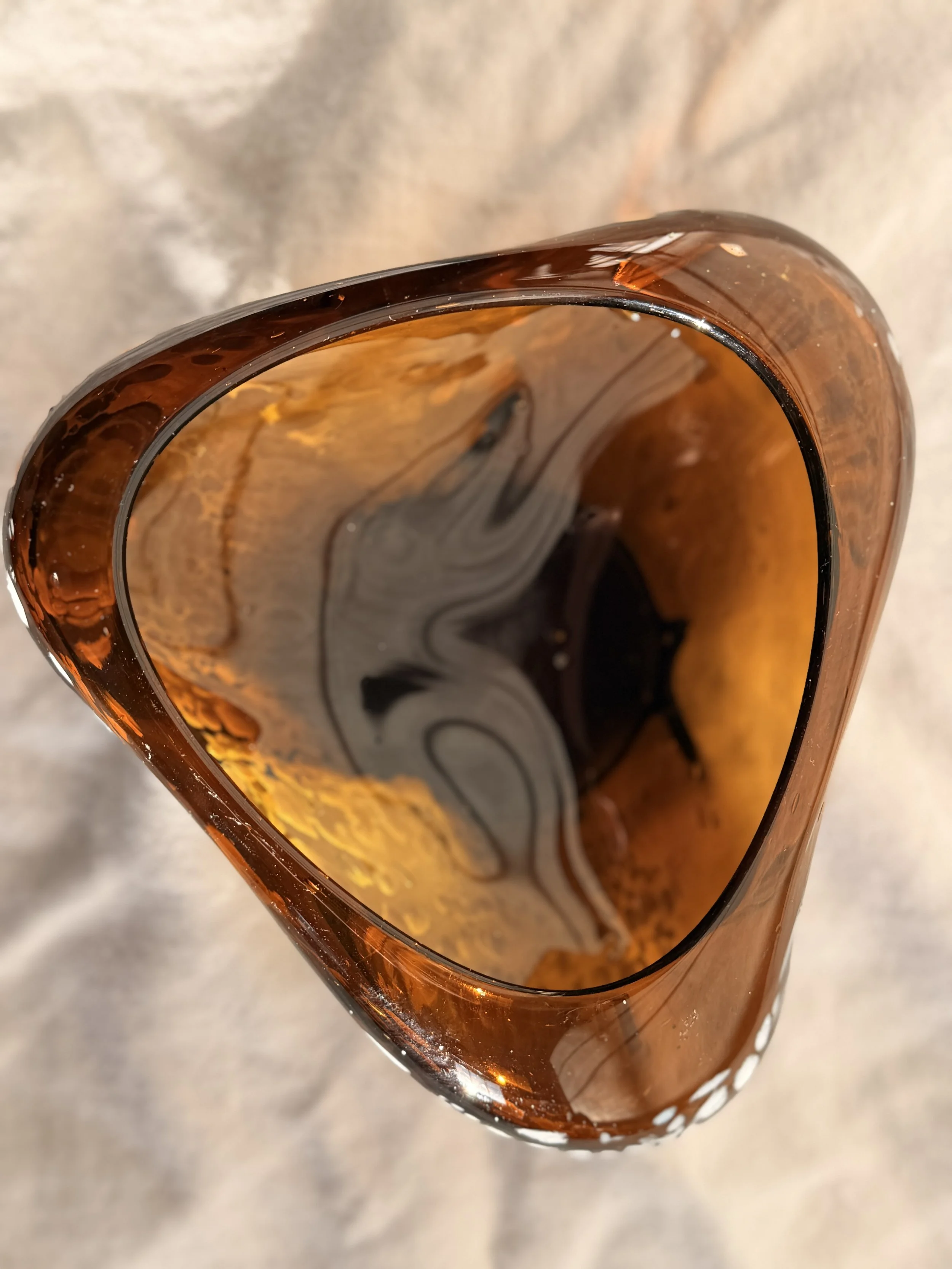 Warm-toned hand-blown glass centerpiece, perfect for rustic or minimalist interior styling.