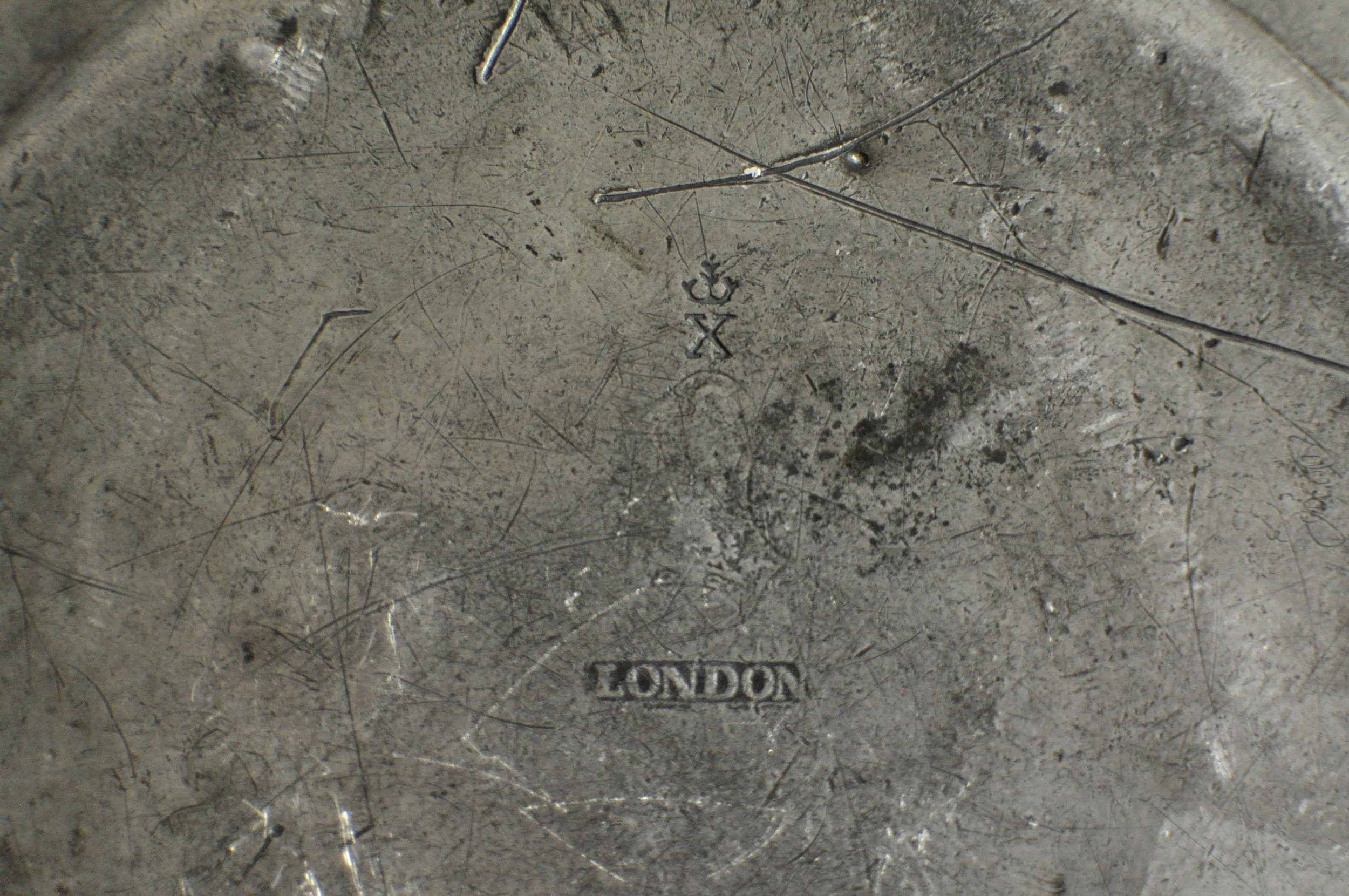 Reverse of Georgian pewter plate showing Crowned X and London touchmarks.