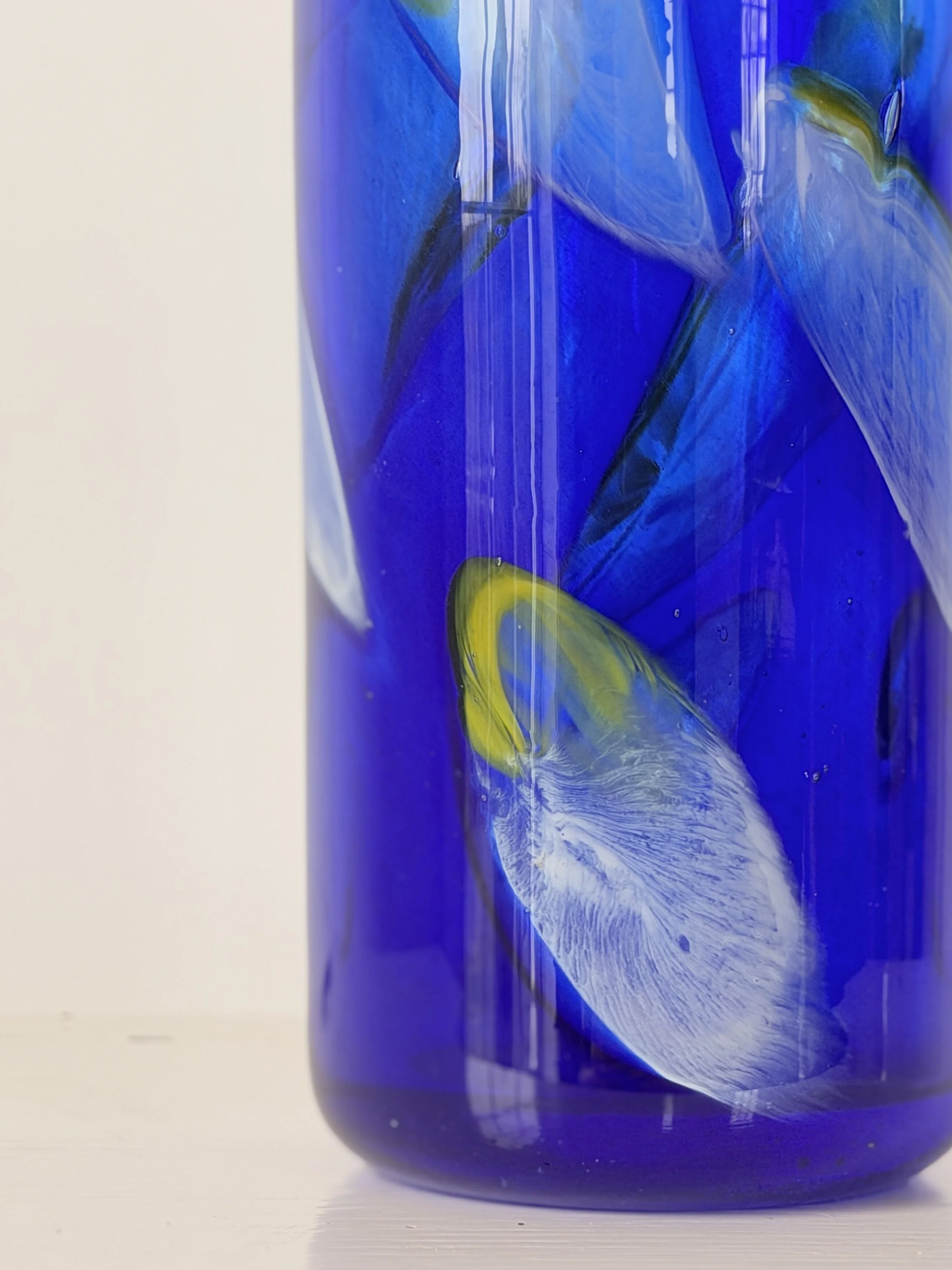 Macro shot of the glass surface, revealing the depth and intensity of the cobalt blue colour.