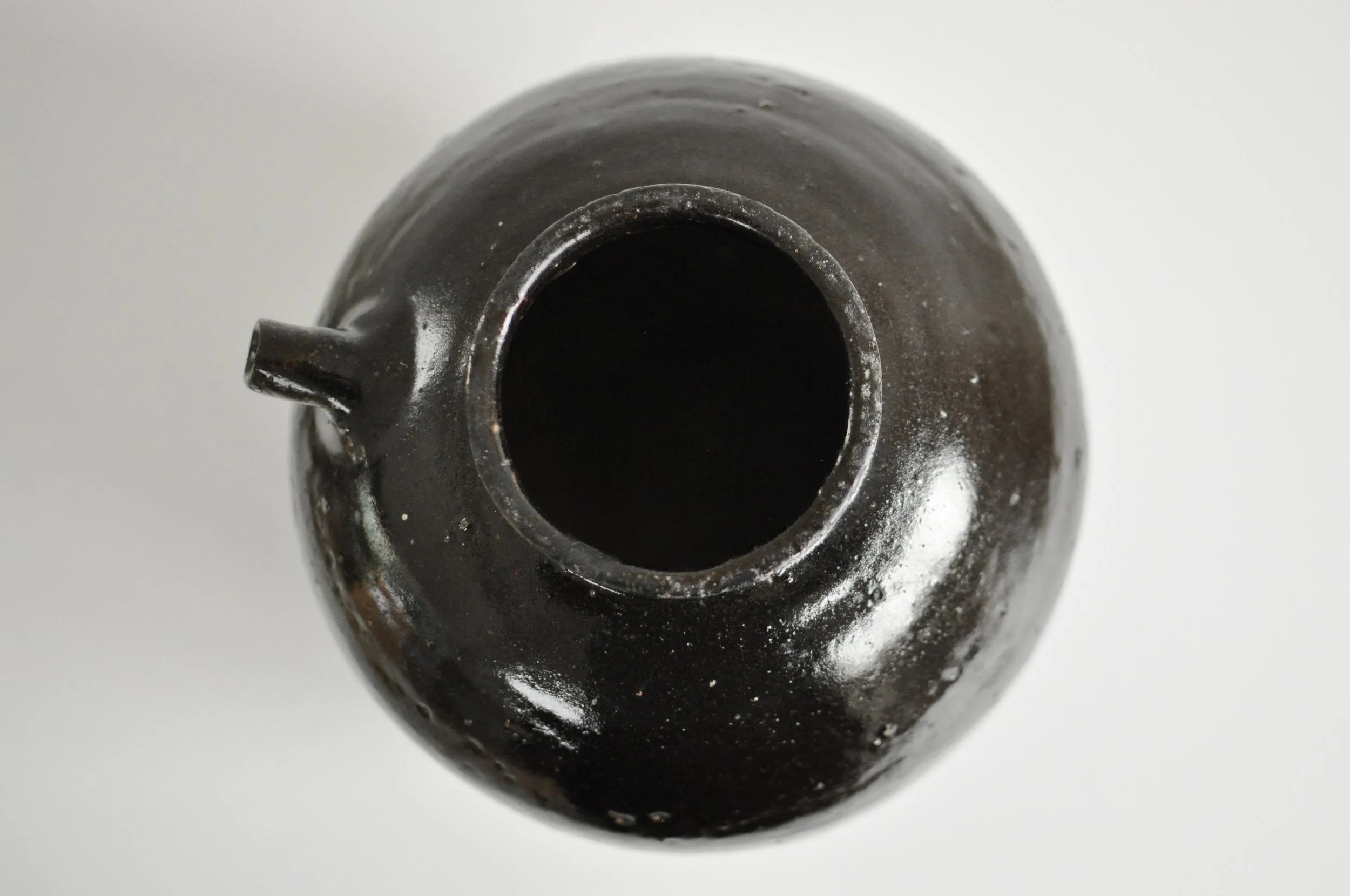 Close up of hand-thrown texture on a 200-year-old antique Chinese vessel.